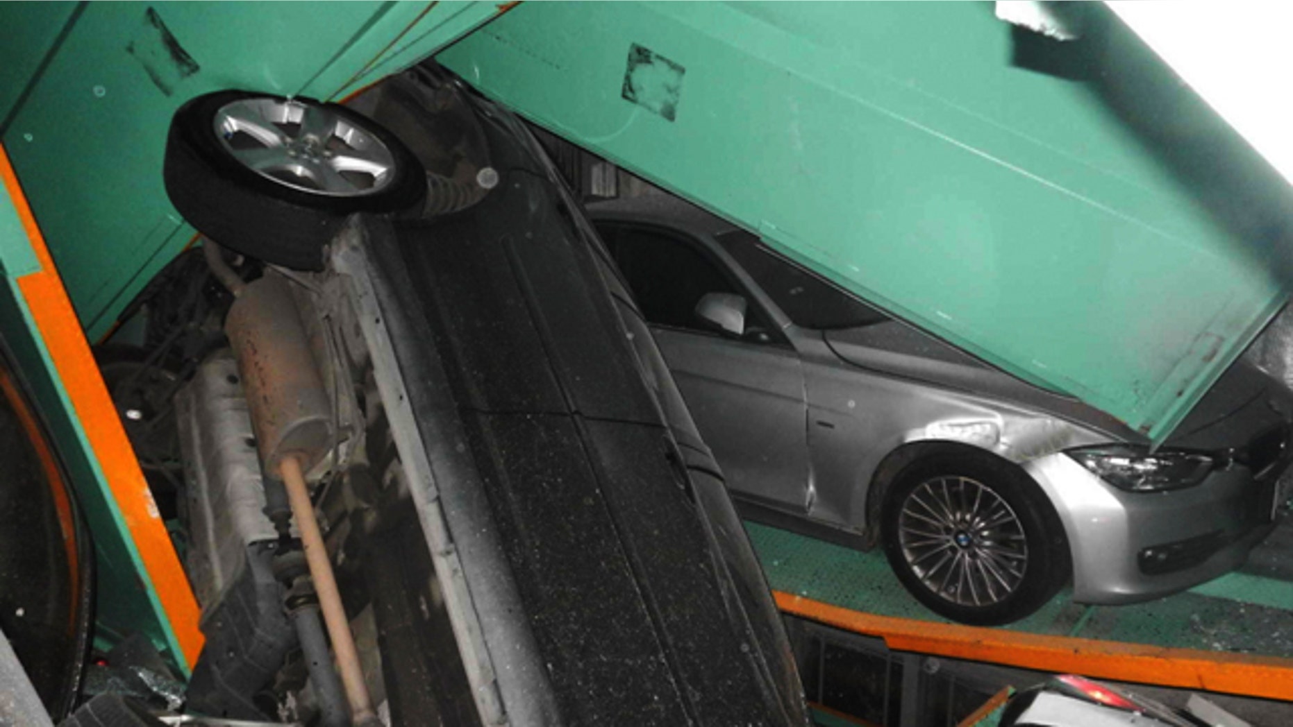 April 20, 2015: In a photo provided by the Taipei Fire Department, vehicles are seen piled on themselves in an automated parking tower after the lift system failed during the 6.3 magnitude earthquake that struck off the island's eastern coast. (Taipei Fire Department via AP)