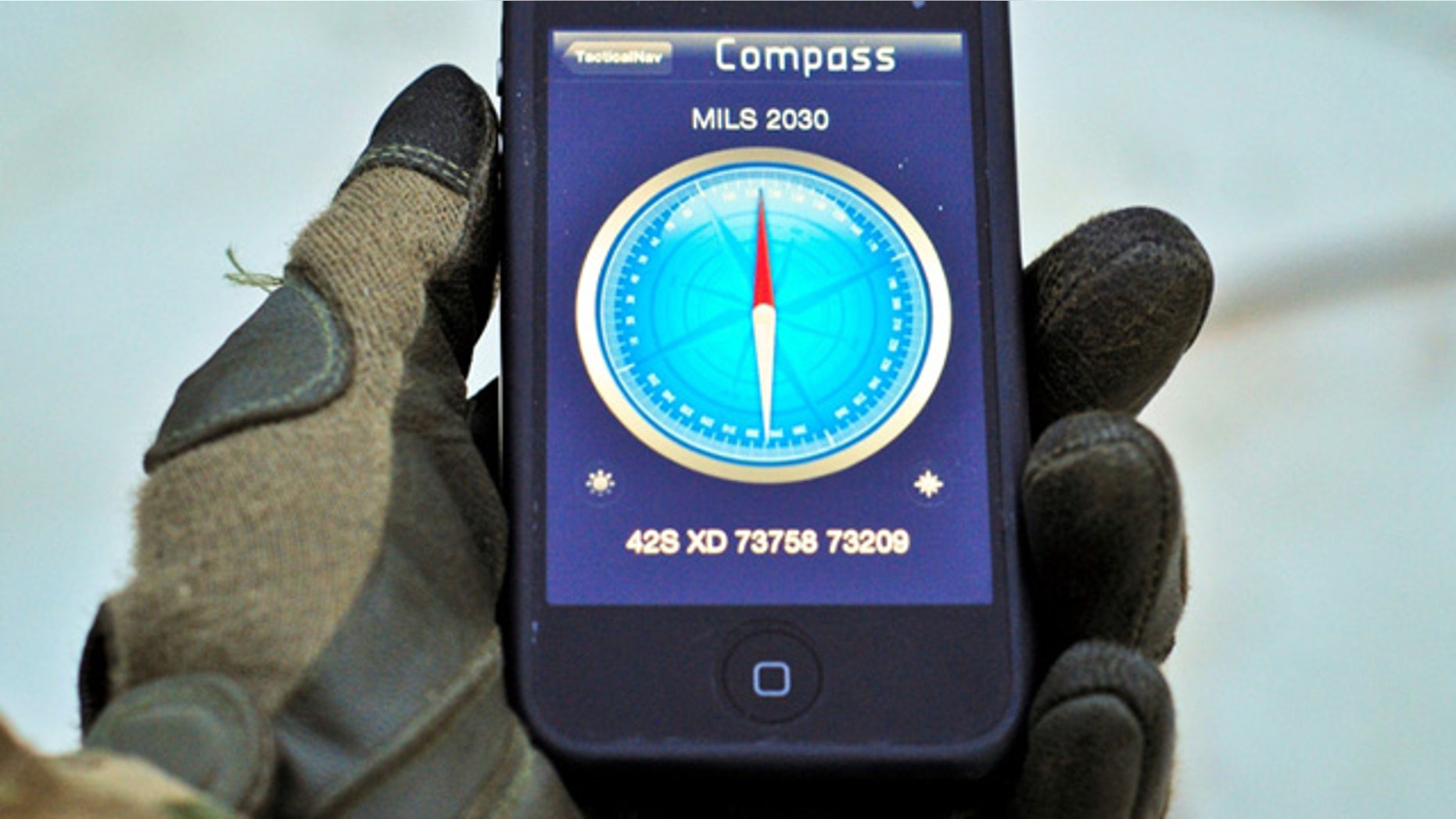 U.S. Army Capt. Jonathan J. Springer tests his new smartphone app in eastern Afghanistan's Pech River Valley Jan. 17. The navigation application displays a Military Grid Reference System, plots waypoints, and gives directions in Mils.