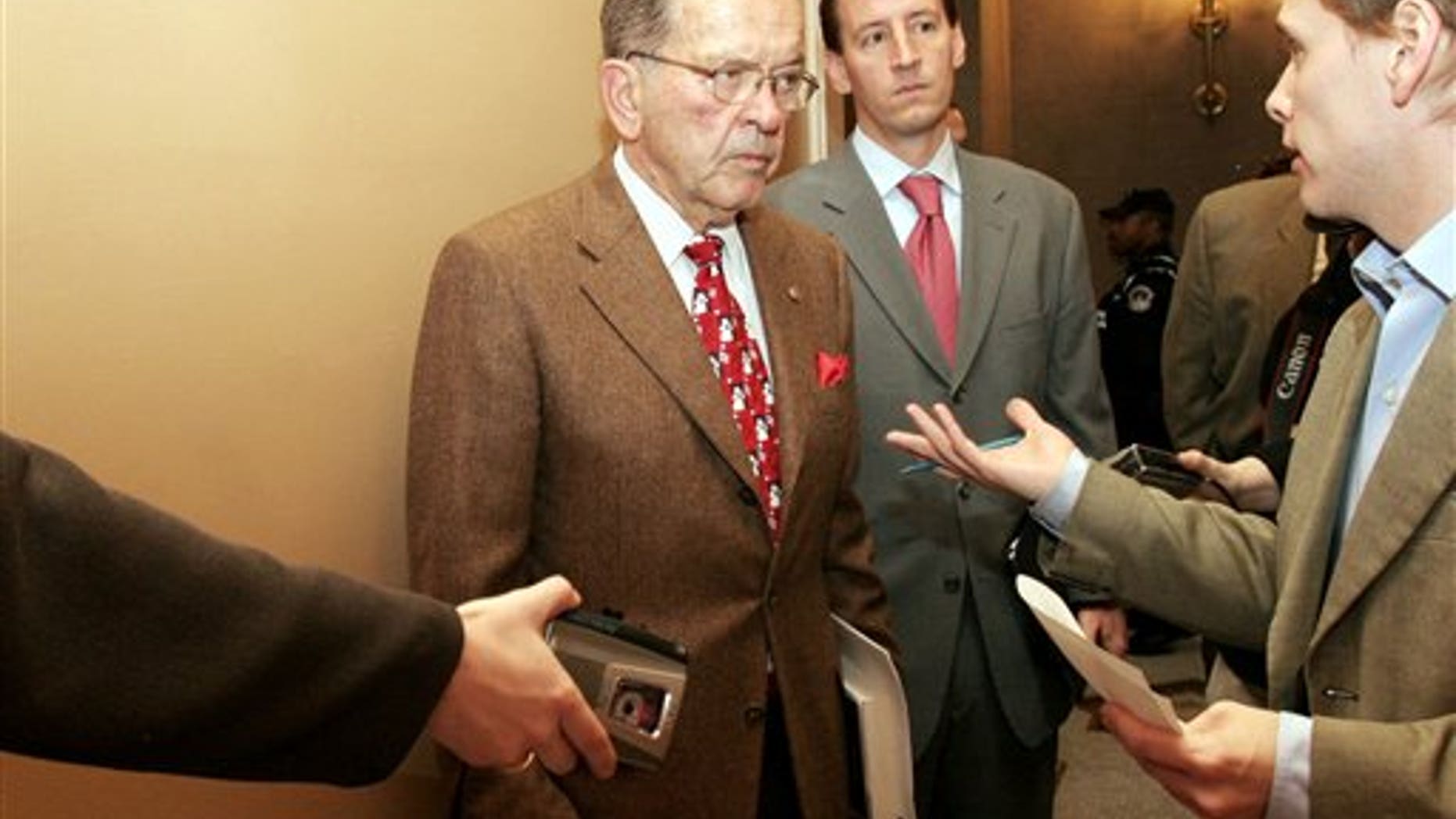 FILE - In this Dec. 19, 2005, file photo, Sen. Ted Stevens, R-Alaska, talks to reporters on Capitol Hill. Stevens died in a plane crash in August 2010 after leaving Congress and having a corruption conviction tossed out in April 2009.