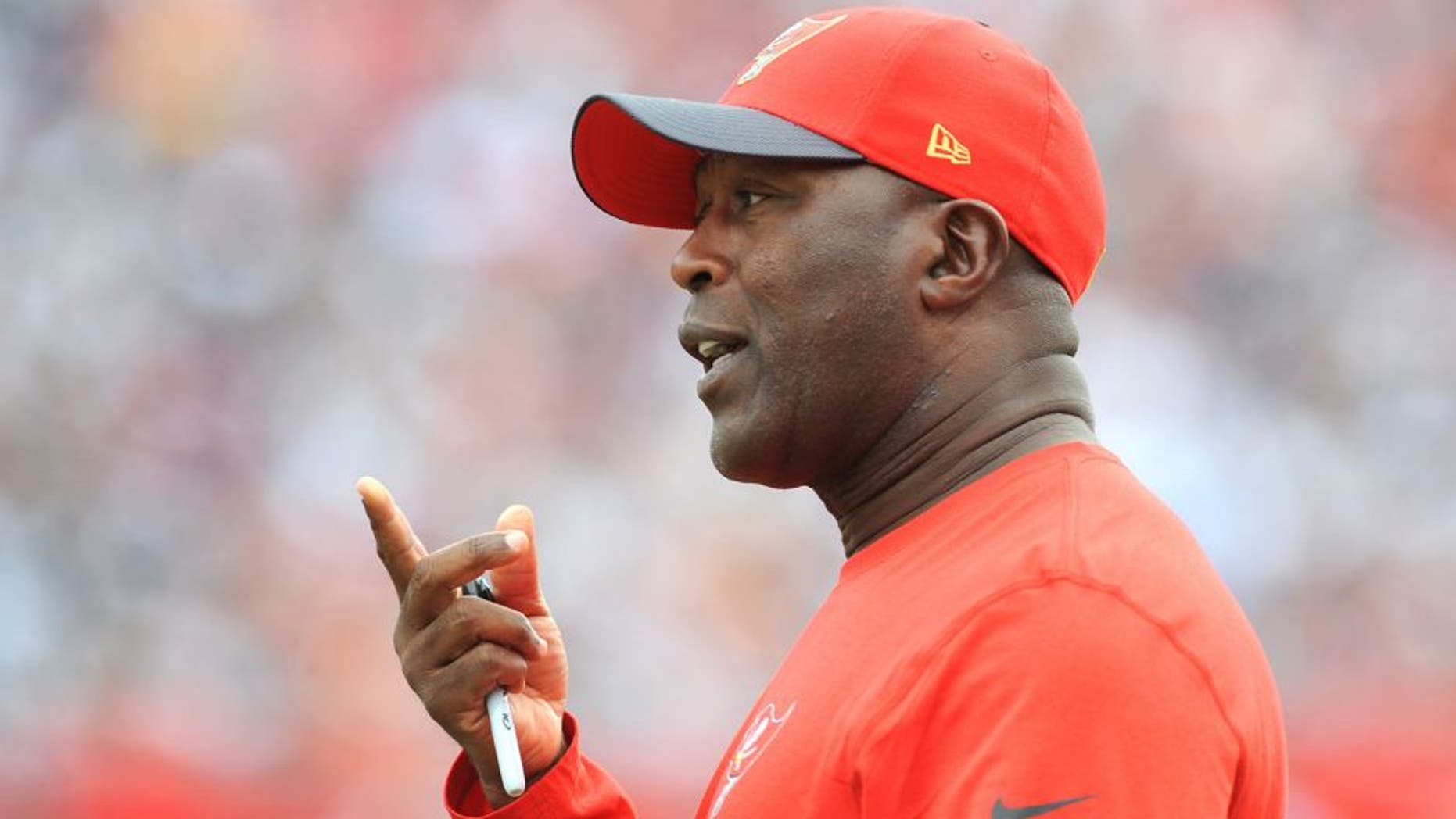 TAMPA, FL - NOVEMBER 15: Head coach Lovie Smith of the Tampa Bay Buccaneers questions an officials call in the second quarter against the Dallas Cowboys at Raymond James Stadium on November 15, 2015 in Tampa, Florida. (Photo by Cliff McBride/Getty Images)