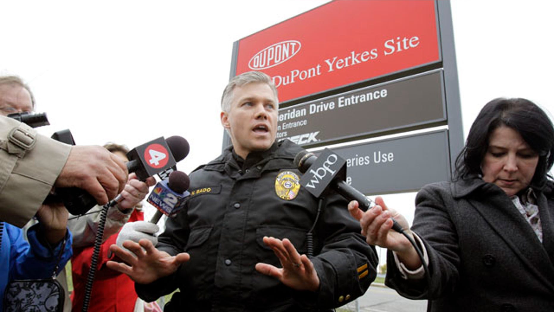 Nov. 9: Tonawanda police officer Nicholas Bado speaks during a news conference at the site of a small tank explosion at a DuPont plant in Tonawanda, N.Y. Police say the explosion killed one worker, injured another and forced part of the building to be evacuated.
