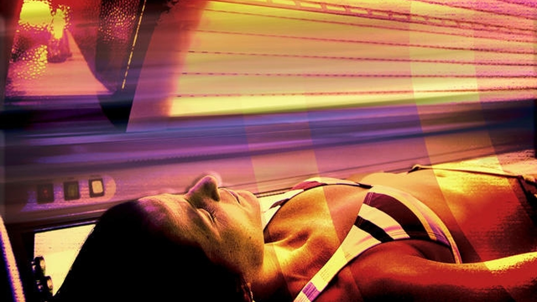 Glenda Fuster lies in a tanning booth with full spectrum lighting at the head at Run to the Sun tanning salon in Anchorage, Alaska, Wednesday, Dec. 14, 2005, to help her cope with the dark winter days. While some Alaskans defy winter by embracing it, others cope by exposing themselves to bright-light therapy, billed by doctors as highly effective. Others install full-spectrum lighting in their homes and offices. Some people frequent tanning booths. Some take antidepressant medications. Some self-medicate with drugs or alcohol. (AP Photo/Al Grillo)