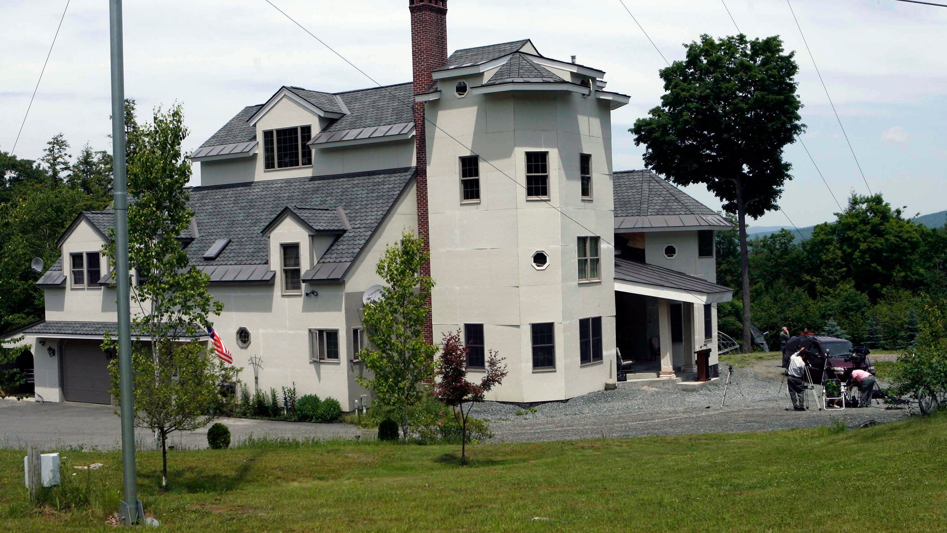 This June 18, 2007, file photo shows the home of Ed and Elaine Brown in Plainfield, N.H. Federal officials preparing to sell the New Hampshire compound of the tax-evading couple convicted of amassing an arsenal of weapons can't guarantee that explosives and other booby traps aren't hidden on the 103-acre spread.
