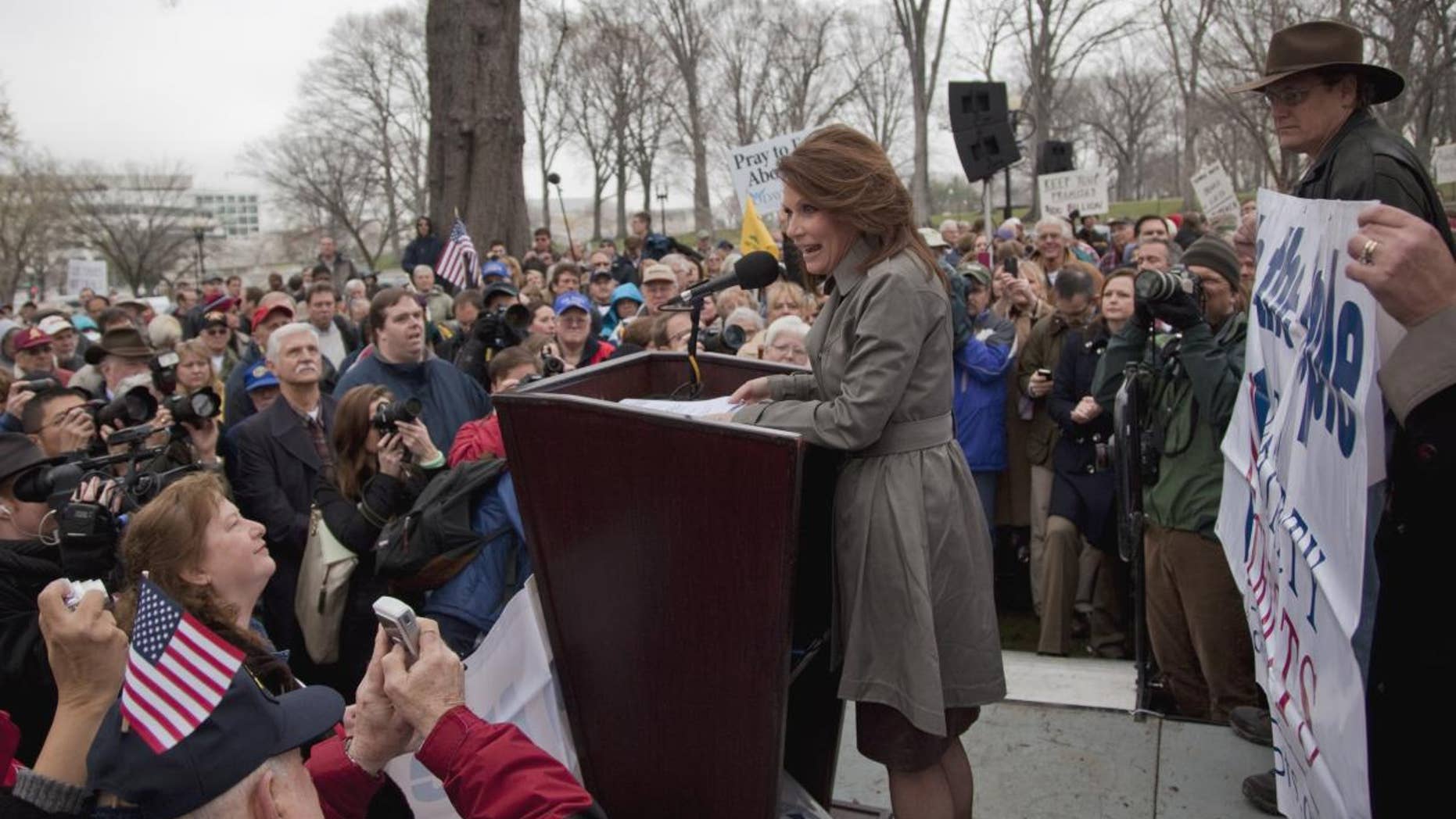 Rep. Michele Bachmann, R-Minn. addresses the Tea Party "Continuing Revolution Rally" on Capitol Hill in Washington, Thursday, March 31, 2011. (AP Photo/Evan Vucci)