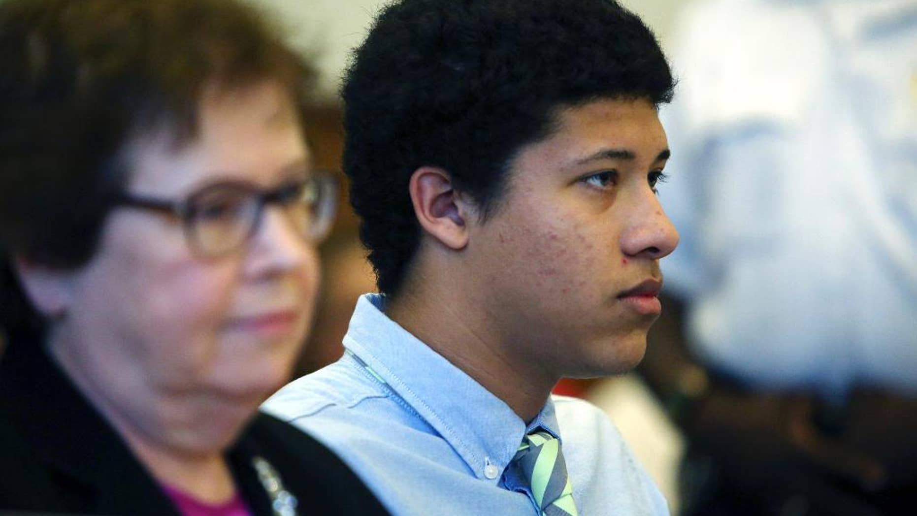 FILE - In this Aug. 12, 2014, file photo, Philip Chism, right, sits with attorney Denise Regan, left, during a hearing in Essex County Superior Court in Salem, Mass. Chism, 15, has been charged as an adult with murder and aggravated rape in the October 2013 slaying of Colleen Ritzer, math teacher at Danvers High School. Chism’s public defender, Regan, is expected to argue in Essex County Superior Court on Friday, Jan. 9, 2015, that police never properly read Chism his Miranda rights and continued to question Chism even after he had invoked his right to remain silent and his mother had asked for a lawyer. (AP Photo/The Salem News, Ken Yuszkus, Pool, File)