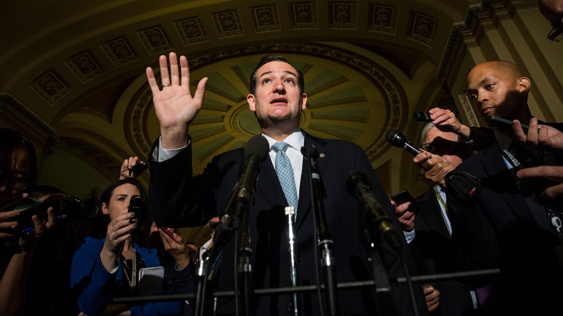 WASHINGTON, DC - OCTOBER 16: U.S. Sen. Ted Cruz (R-TX) speaks after meeting with Republican senators regarding a bipartisan solution for the pending budget and debt limit impasse at the U.S. Capitol October 16, 2013 in Washington, DC. The Senate announced that it had reached a bipartisan deal on funding the federal government and the extending the nation's debt limit after 16 days of a government shutdown. (Photo by Andrew Burton/Getty Images)