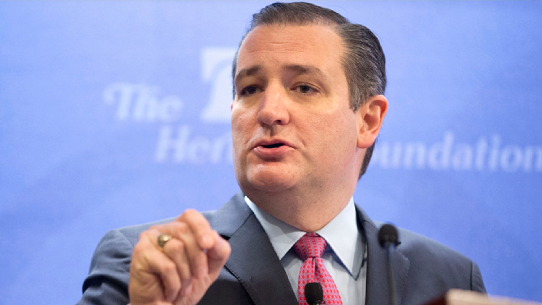 FILE - In this Dec. 10, 2015 file photo, Republican presidential candidate Sen. Ted Cruz, R-Texas speaks in Washington. Donald Trump will be standing at center stage, but Cruz will be in the spotlight during Tuesdayâs Republican presidential debate. The Texas senator is challenging Trumpâs lead in Iowa, and has the money, campaign infrastructure and conservative appeal to compete deep into the GOP primary season. (AP Photo/Pablo Martinez Monsivais, File)
