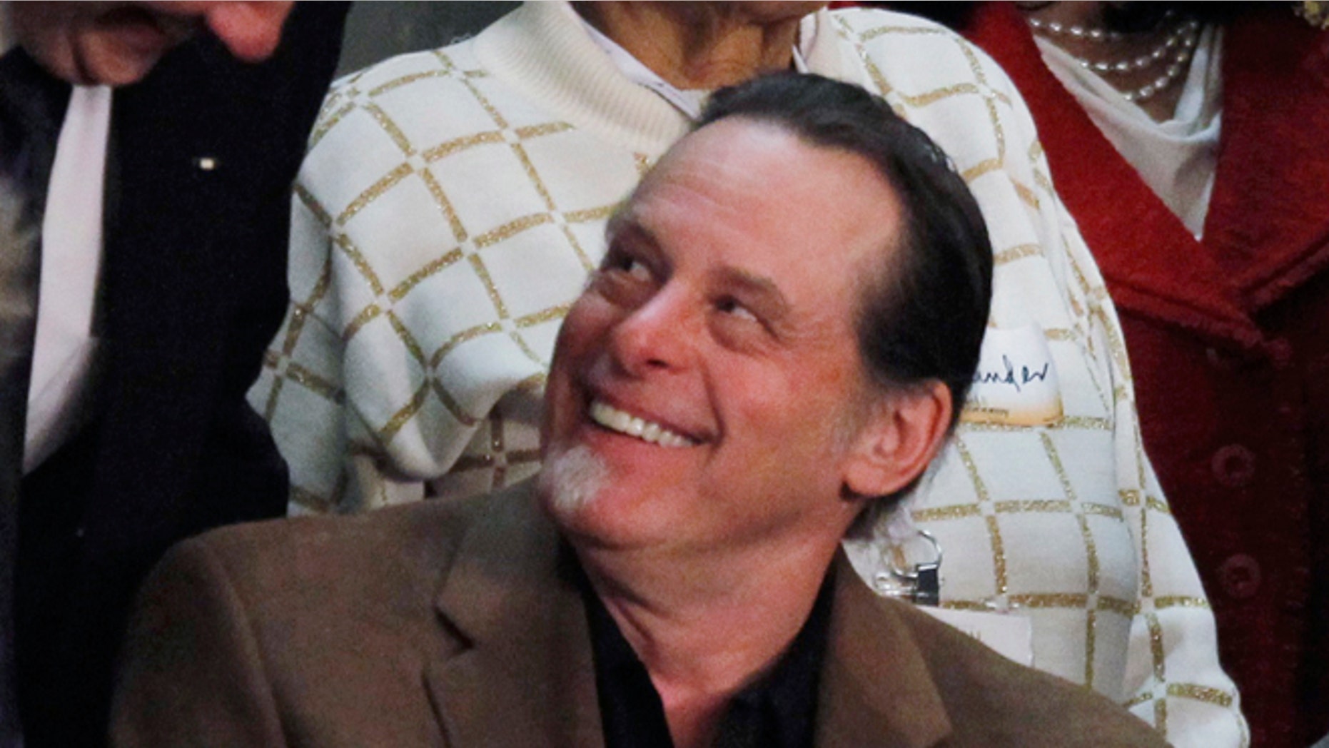 This Feb. 12, 2013 file photo shows musician Ted Nugent, guest of Rep. Steve Stockman, R-Texas, before the State of the Union address by President Barack Obama on Capitol Hill in Washington.