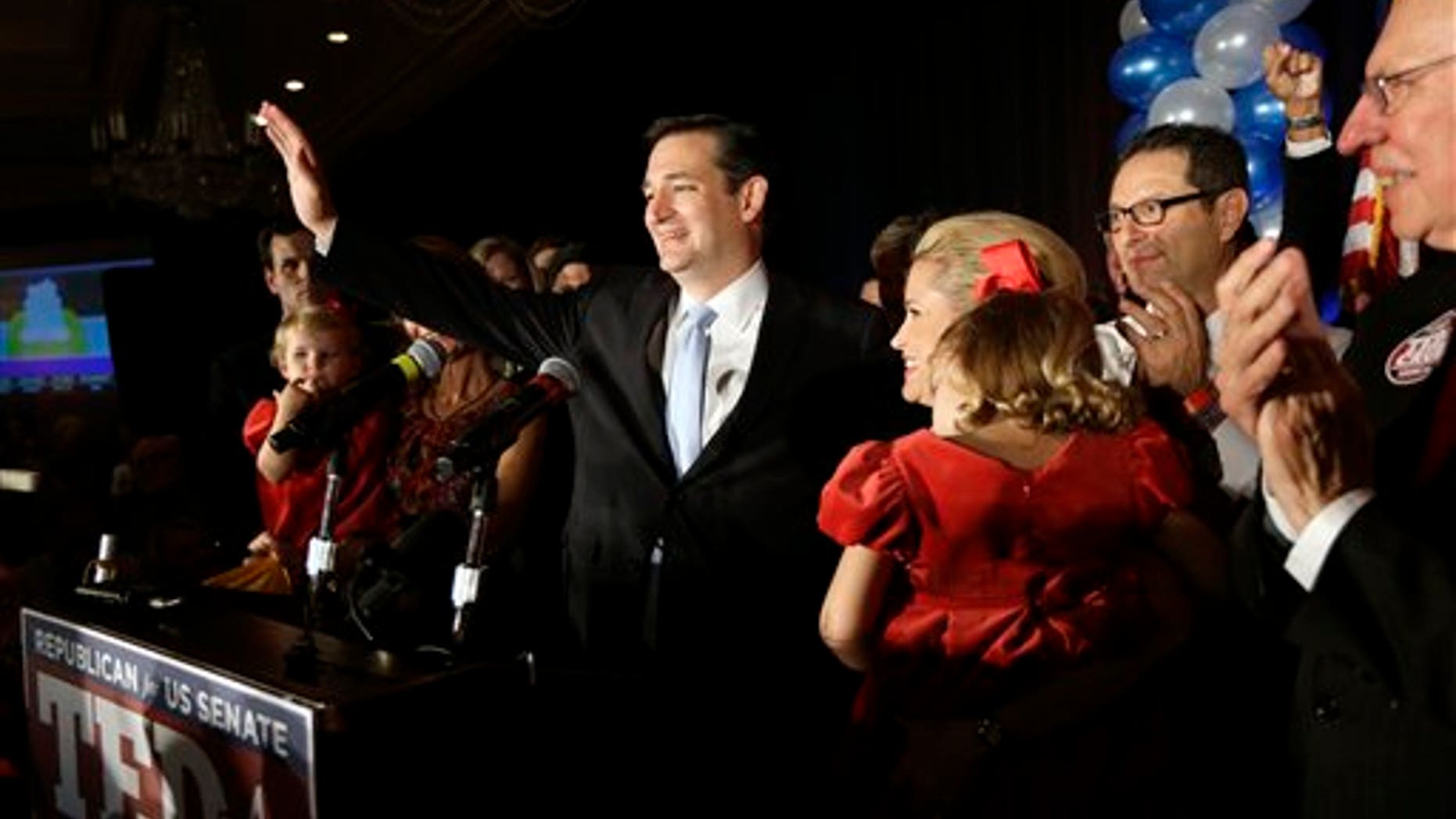 Nov. 6, 2012: Republican candidate for U.S. Senate Ted Cruz thanks the crowd during a victory speech as he is joined on stage by his wife Heidi, right, in Houston.