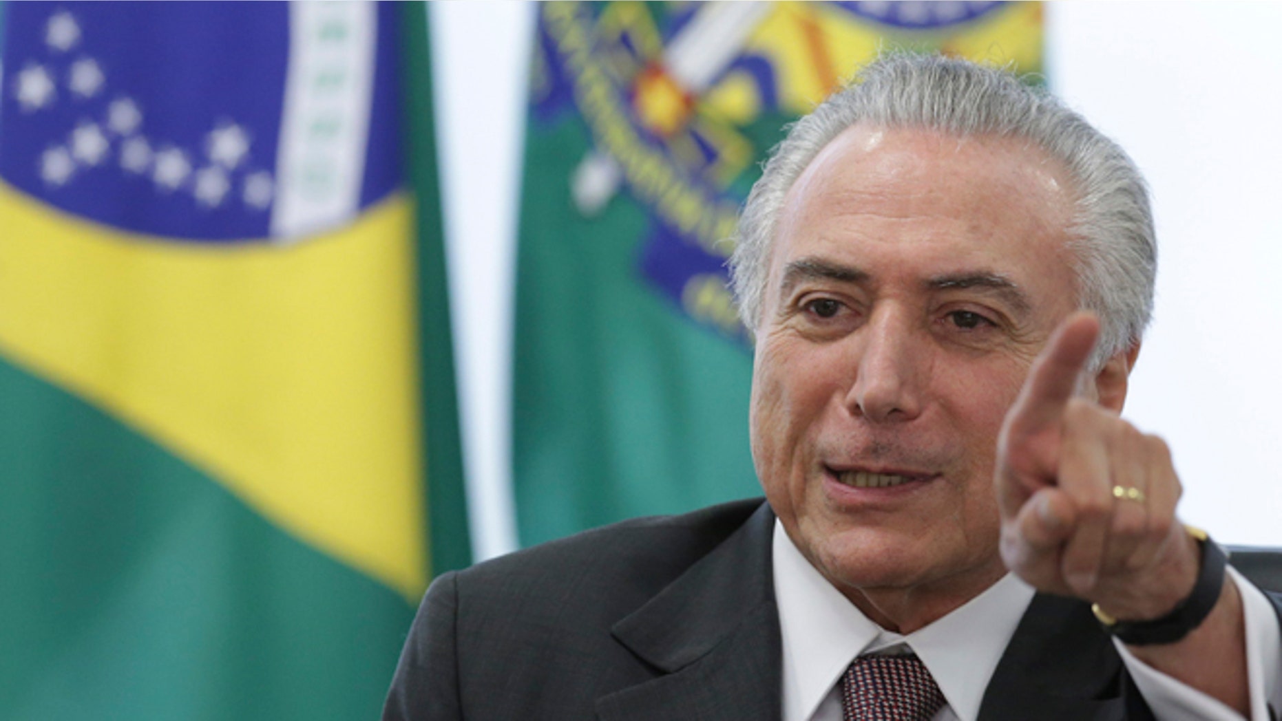 Brazil's acting President Michel Temer speaks during a meeting with trade unions, on the government's proposal for Social Security reform, at the Planalto Presidential Palace, in Brasilia, Brazil, Monday, May 16, 2016. Temer, Dilma Rousseff's two-time running-mate turned nemesis, immediately assumed power after her May 12 suspension and will remain while an impeachment trial takes place within the next six months. (AP Photo/Eraldo Peres)