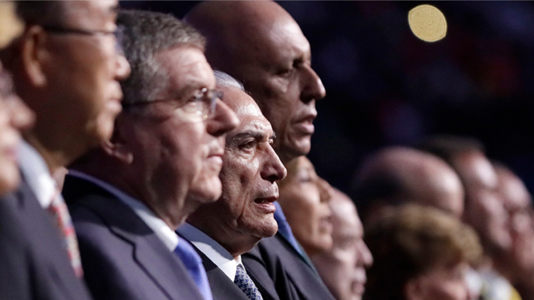 Brazil interim President Michel Temer, third from left, sings the Brazilian national anthem during the opening ceremony for the 2016 Summer Olympics in Rio de Janeiro, Brazil, Friday, Aug. 5, 2016. (AP Photo/Mark Humphrey, Pool)