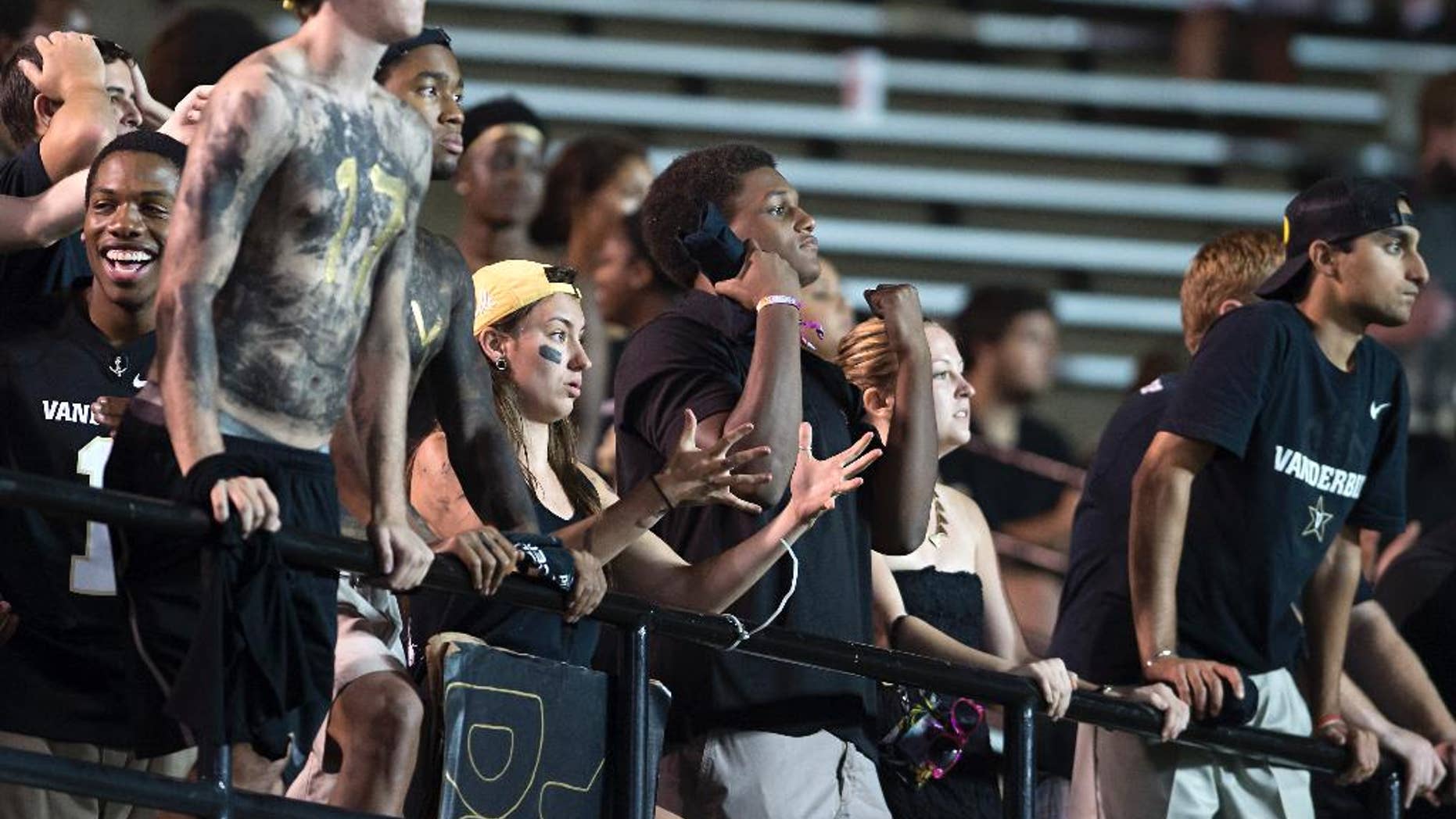 Vanderbilt fans react to a dropped pass in the fourth quarter of an NCAA college football game Friday, Aug. 29, 2014, in Nashville, Tenn. (AP Photo/Brian Powers)