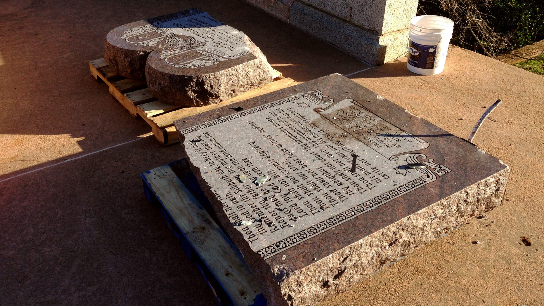 Oct. 24, 2014: The damaged remains of a Ten Commandments monument are gathered on the Oklahoma State Capitol grounds in Oklahoma City. (AP/Sean Murphy)