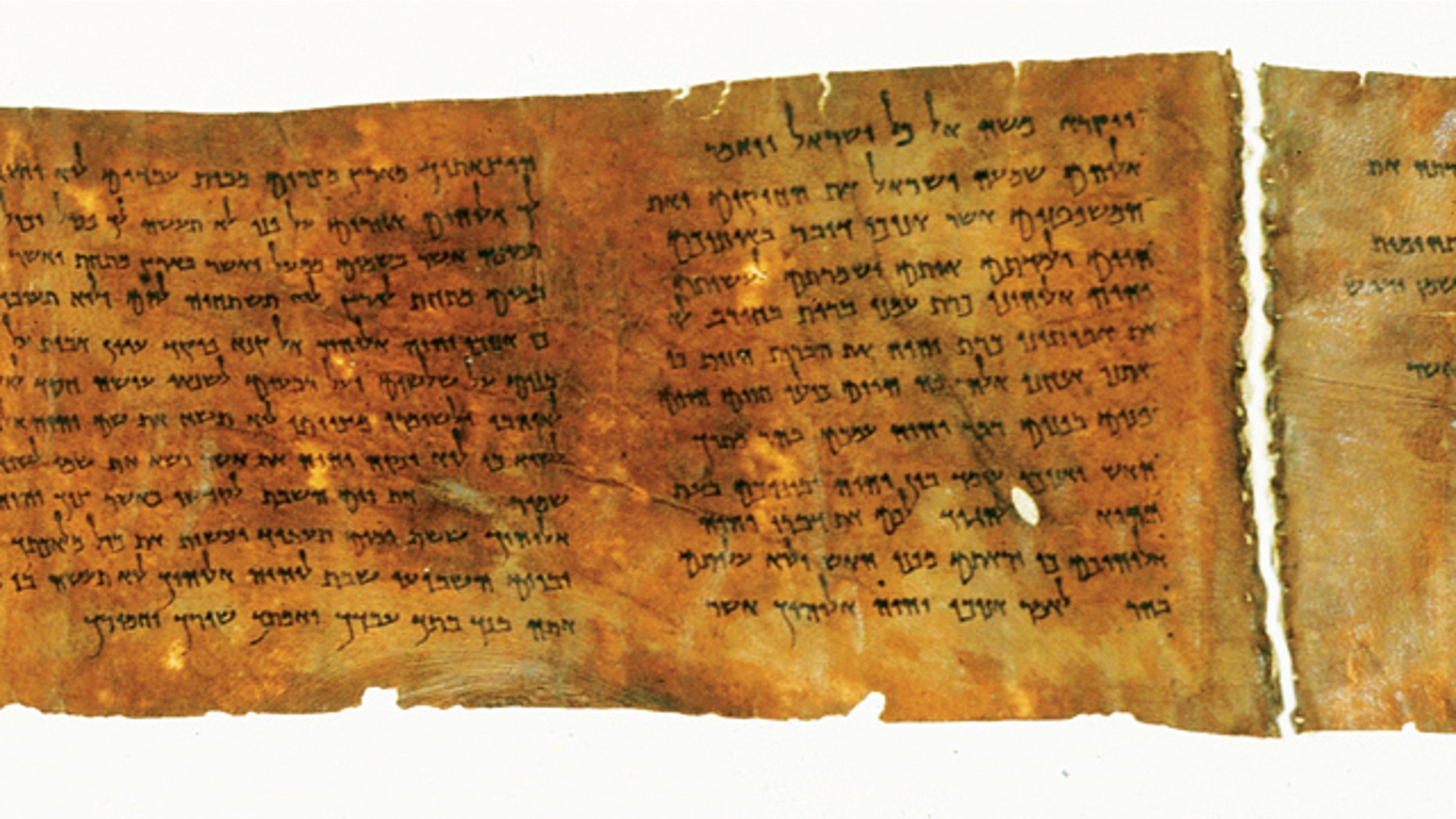A portion of the oldest complete copy of the Ten Commandments, on display potentially for the final time in New York CIty's Times Square.