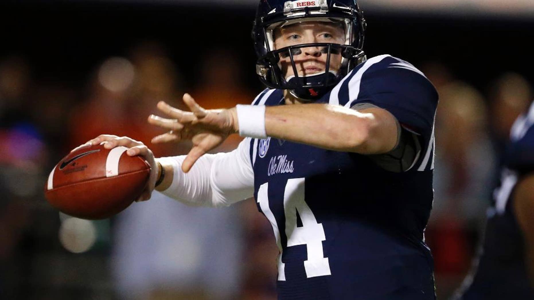 Mississippi quarterback Bo Wallace readies to pass against Tennessee in the second half of an NCAA college football game in Oxford, Miss., Saturday, Oct. 18, 2014. No. 3 Mississippi won 34-3. (AP Photo/Rogelio V. Solis)