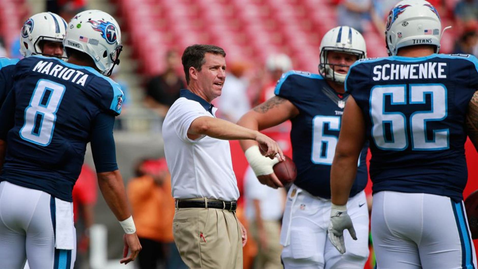 Sep 13, 2015; Tampa, FL, USA; Tennessee Titans quarterback coach John McNulty talks with center Brian Schwenke (62), quarterback Zach Mettenberger (7) and quarterback Marcus Mariota (8) prior to the game at Raymond James Stadium. Mandatory Credit: Kim Klement-USA TODAY Sports