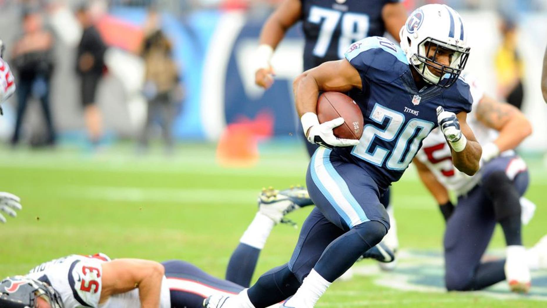 Dec 27, 2015; Nashville, TN, USA; Tennessee Titans running back Bishop Sankey (20) runs for a first down during the second half against the Houston Texans at Nissan Stadium. The Texans won 34-6. Mandatory Credit: Christopher Hanewinckel-USA TODAY Sports