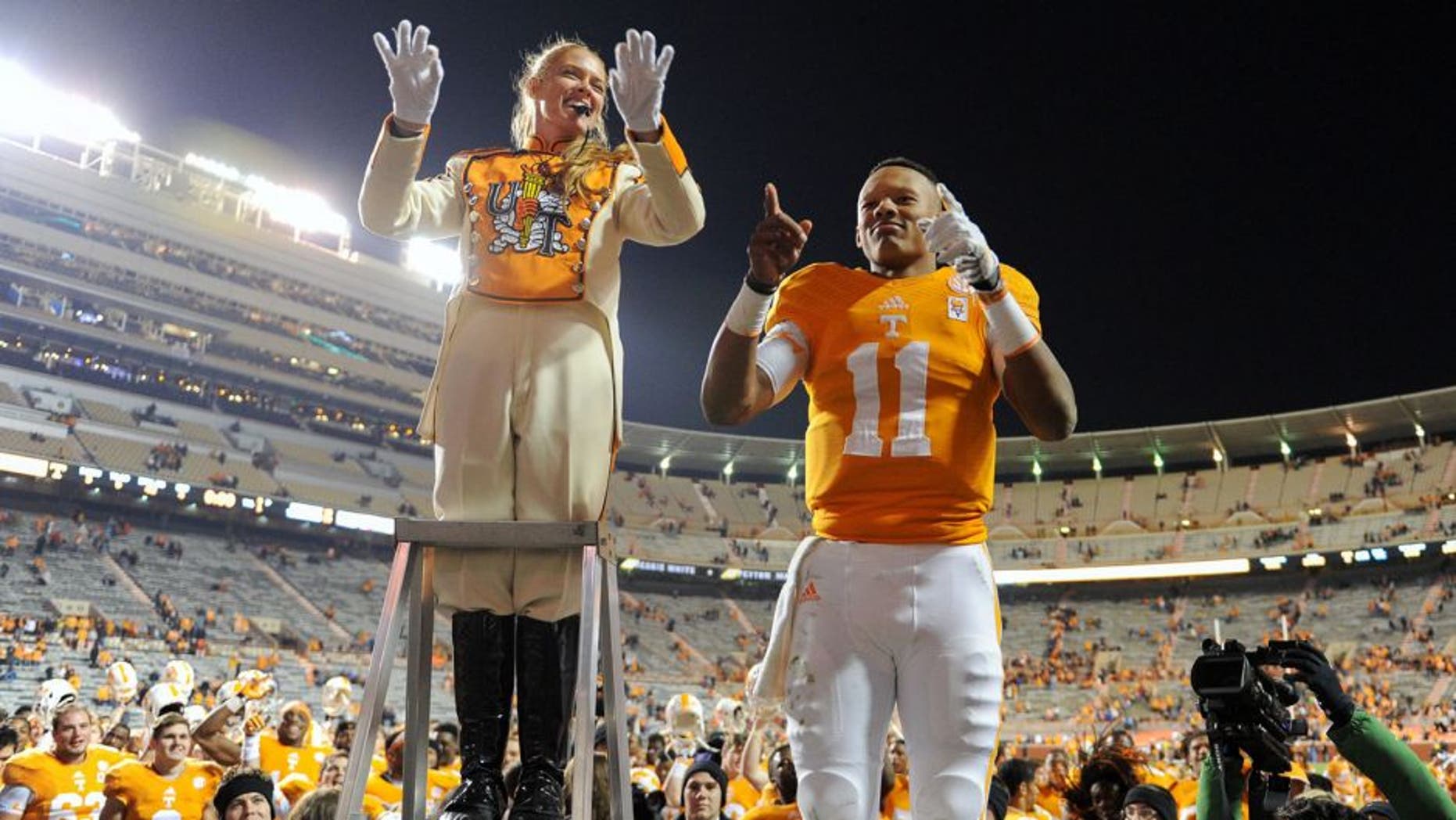Nov 15, 2014; Knoxville, TN, USA; Tennessee Volunteers quarterback Joshua Dobbs (11) leads the band after the game against the Kentucky Wildcats at Neyland Stadium. Tennessee won 50 to 16. Mandatory Credit: Randy Sartin-USA TODAY Sports