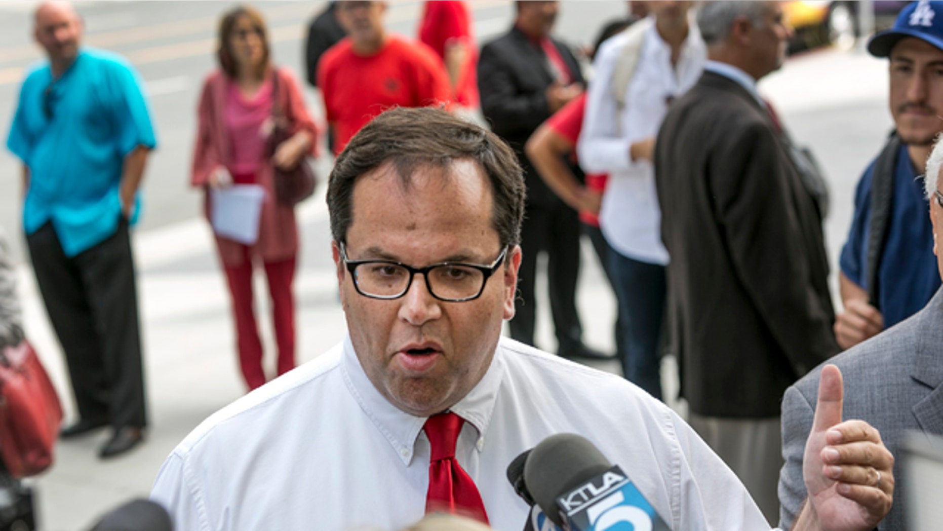 June 10, 2014: Alex Caputo-Pearl, president elect of the United Teachers Los Angeles, UTLA, takes questions on the Vergara v. California lawsuit verdict in Los Angeles. A judge struck down tenure and other job protections for California's public school teachers as unconstitutional, saying such laws harm students, especially poor and minority ones by saddling them with bad teachers. (AP Photo/Damian Dovarganes)