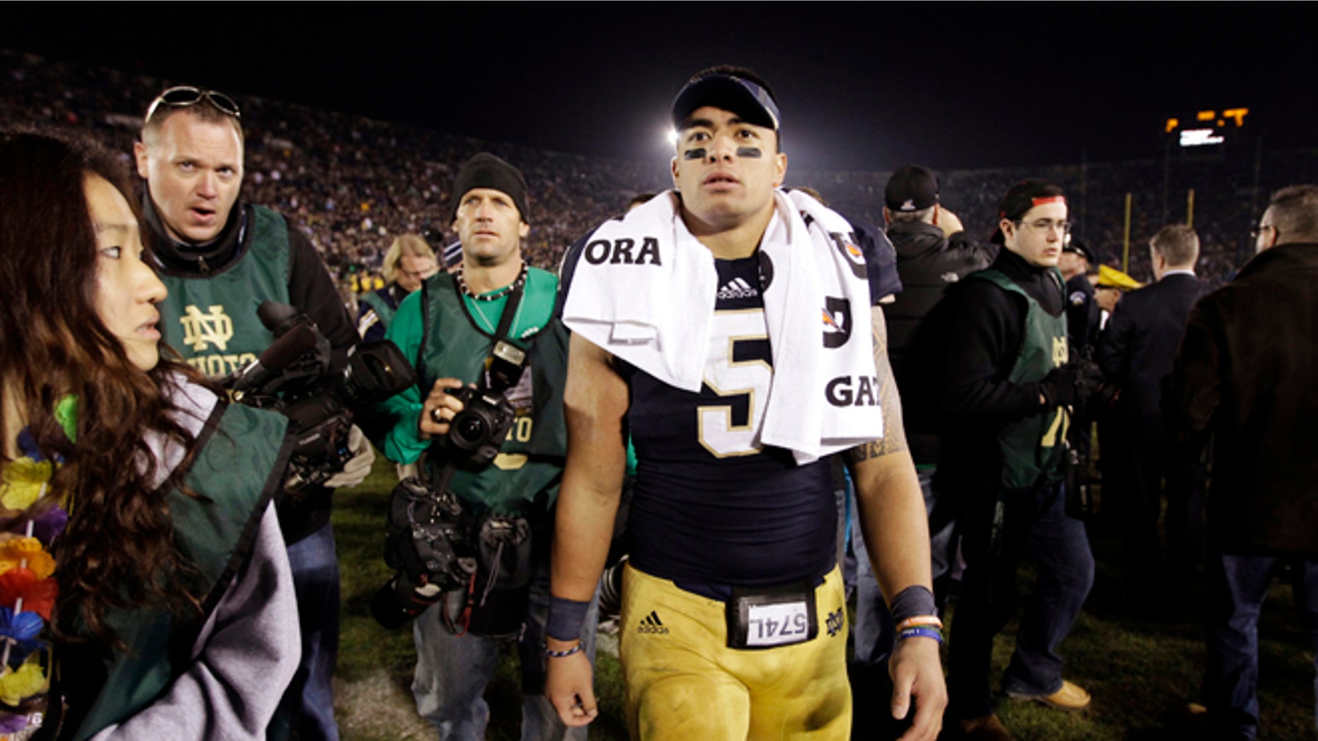 Nov. 17, 2012: In this file photo, Notre Dame linebacker Manti Te'o walks off the field following an NCAA college football game against Wake Forest in South Bend, Ind.