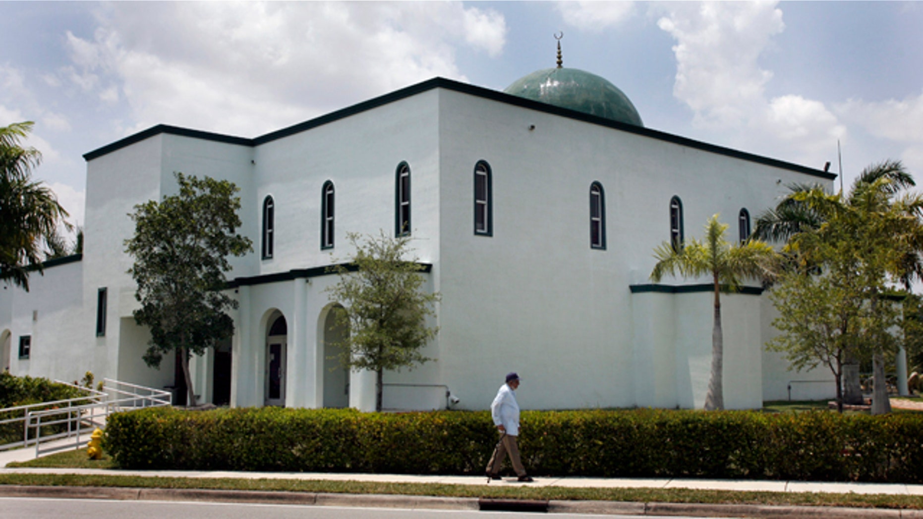 May 14: A pedestrian walks past the Jamat Al-Mummineen Mosque in Margate, Fla., where imam Izhar Khan has been charged with providing about $50,000 in financial support to the Pakistani Taliban.