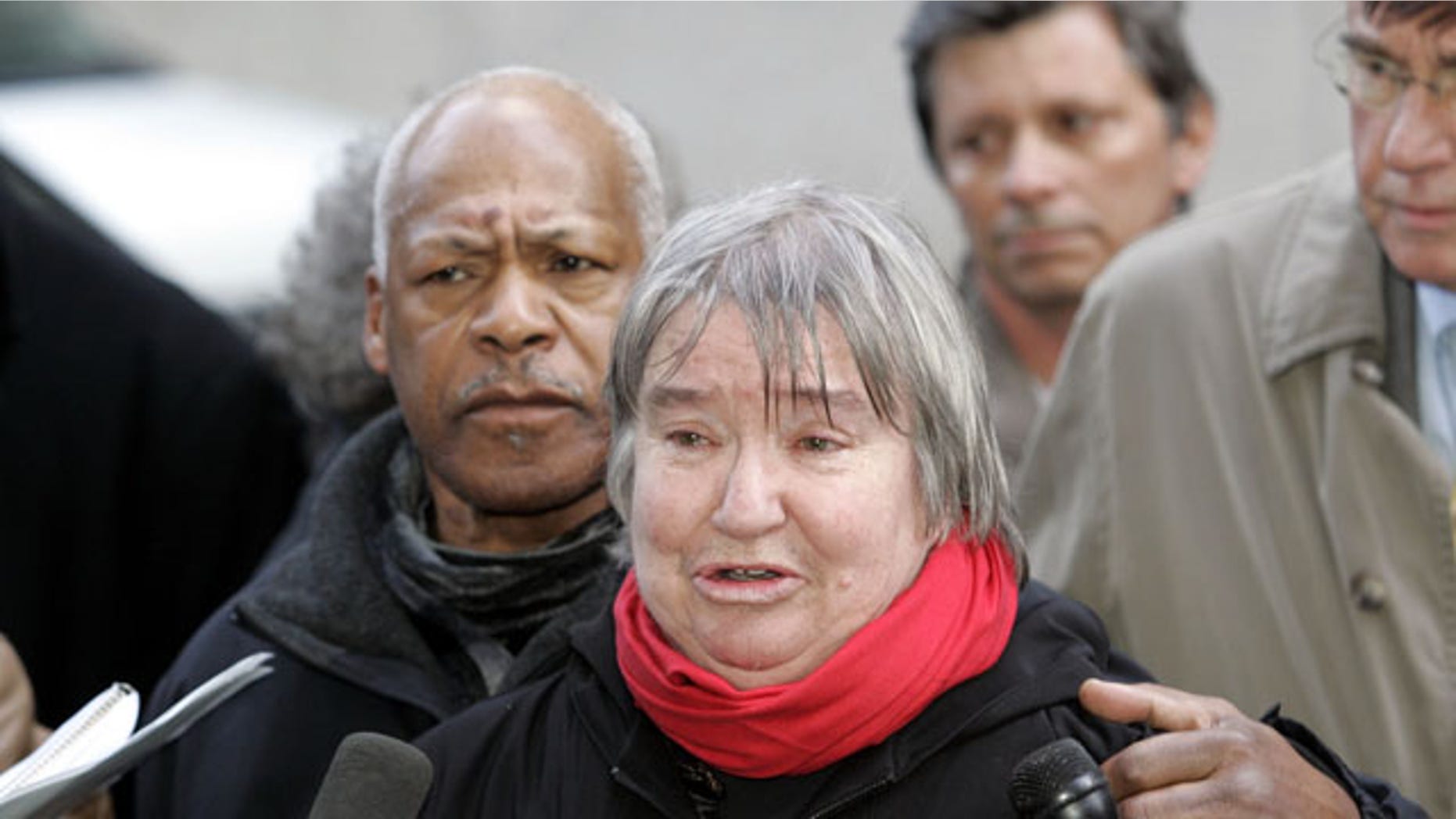FILE - In this Feb. 10, 2005 file photo, attorney Lynne Stewart cries as she speaks to the press with her husband Ralph Pointer next to her, left, outside Federal Court in New York. Stewart, a former civil rights lawyer convicted in a terrorism case and sentenced to 10 years in prison is entitled to compassionate release because she has less than 18 months to live. (AP Photo)