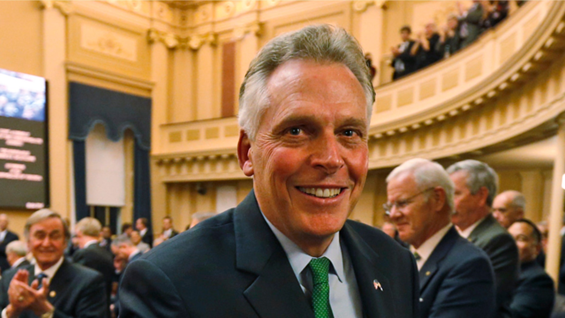 In this Wednesday, Jan. 14, 2015 photo Virginia Gov. Terry McAuliffe leaves the chambers after delivering his annual State of the Commonwealth address at the Capitol in Richmond, Va.