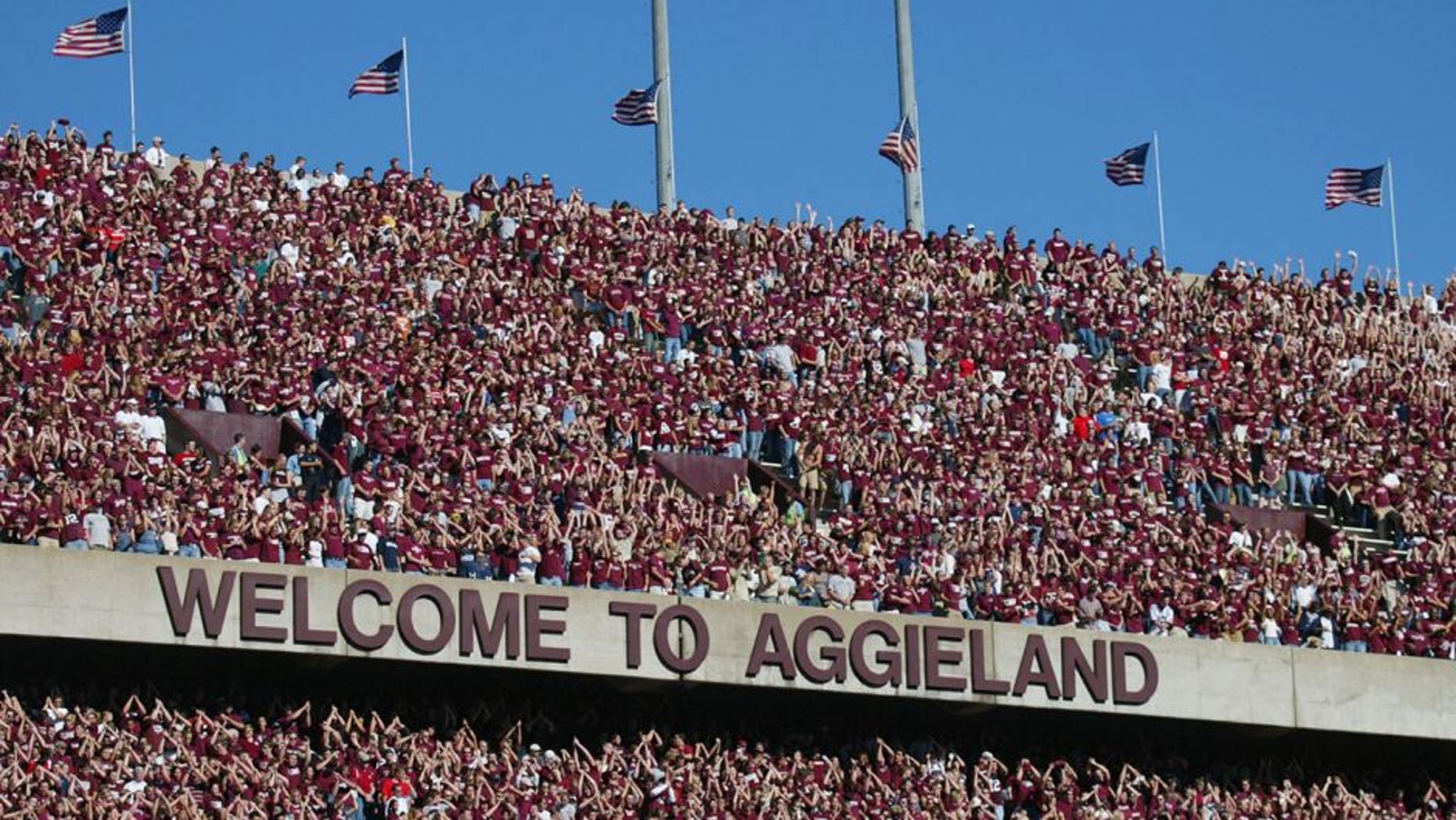 COLLEGE STATION, TX - NOVEMBER 6: Texas A&M University Aggies fans, sometimes referred to as the 12th Man, watch the game against the University of Oklahoma Sooners on November 6, 2004 at Kyle Field in College Station, Texas. The Sooners defeated the Aggies 42-35. (Photo by Ronald Martinez/Getty Images)