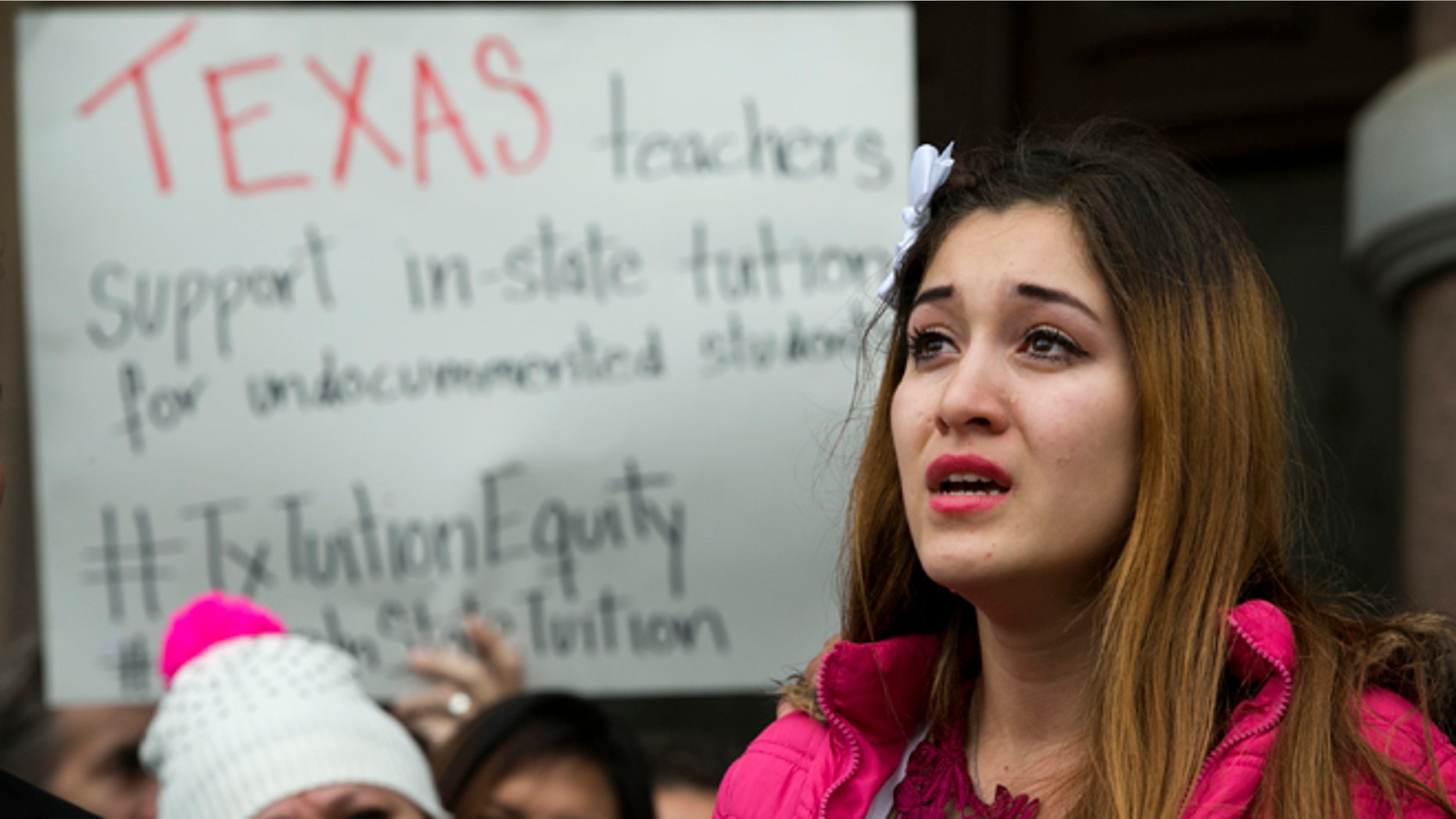 Nahiely Garcia, 19, of Edinburg, cries as she speaks in support of the HB1403, the Texas DREAM Act, at a demonstration at the Capitol in Austin, Texas, on Wednesday January 14, 2015. More 50 people, a coalition of businesses, affected students, supporters, and lawmakers, rallied to preserve the 2001 in-state tuition law. (AP Photo/Austin American-Statesman, Jay Janner)
