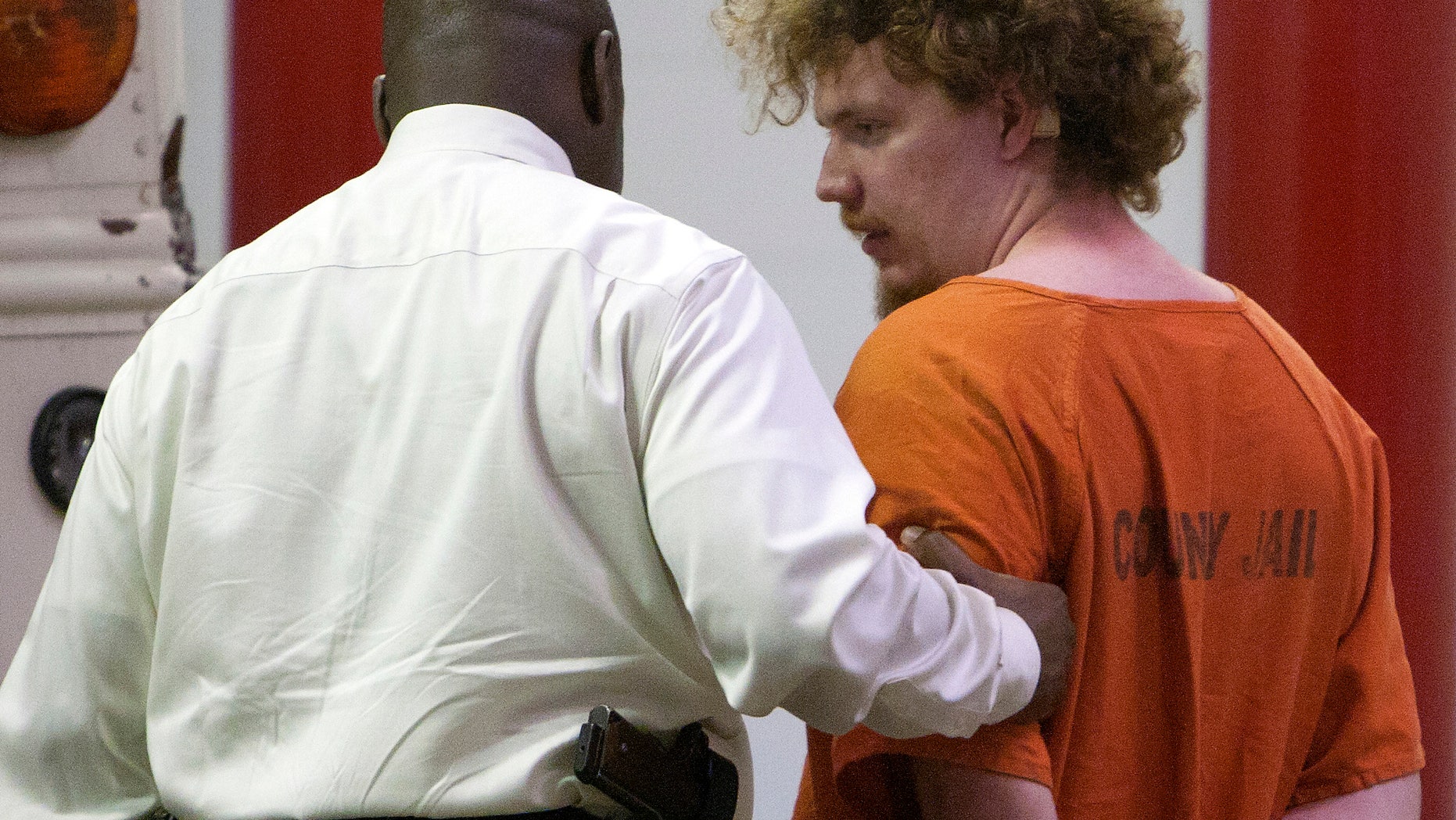 April 9, 2013: Dylan Quick, who is a suspect in the multiple stabbings on the Lone Star Cy-Fair Campus, right, is escorted by Harris County Sherrif's Office investigators after being questioned in Houston.