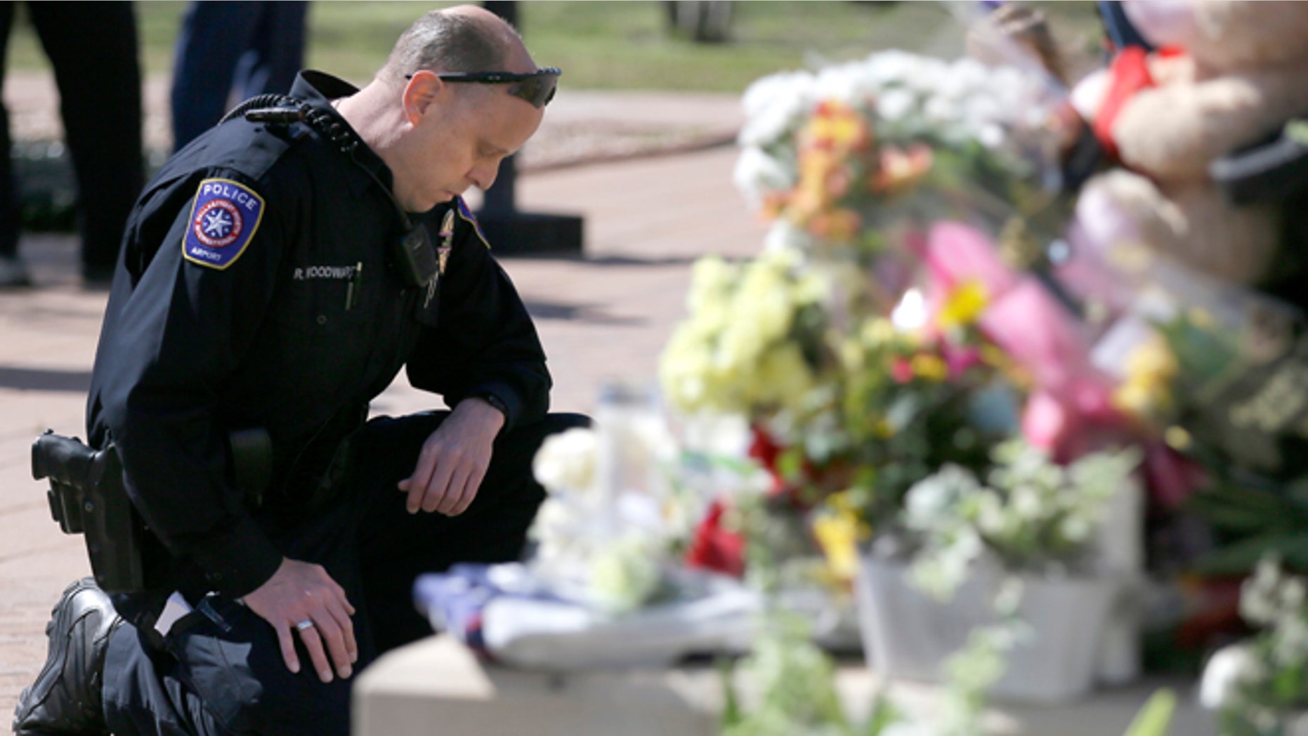 A makeshift memorial for a slain officer at the Euless Police Department Wednesday, March 2, 2016.