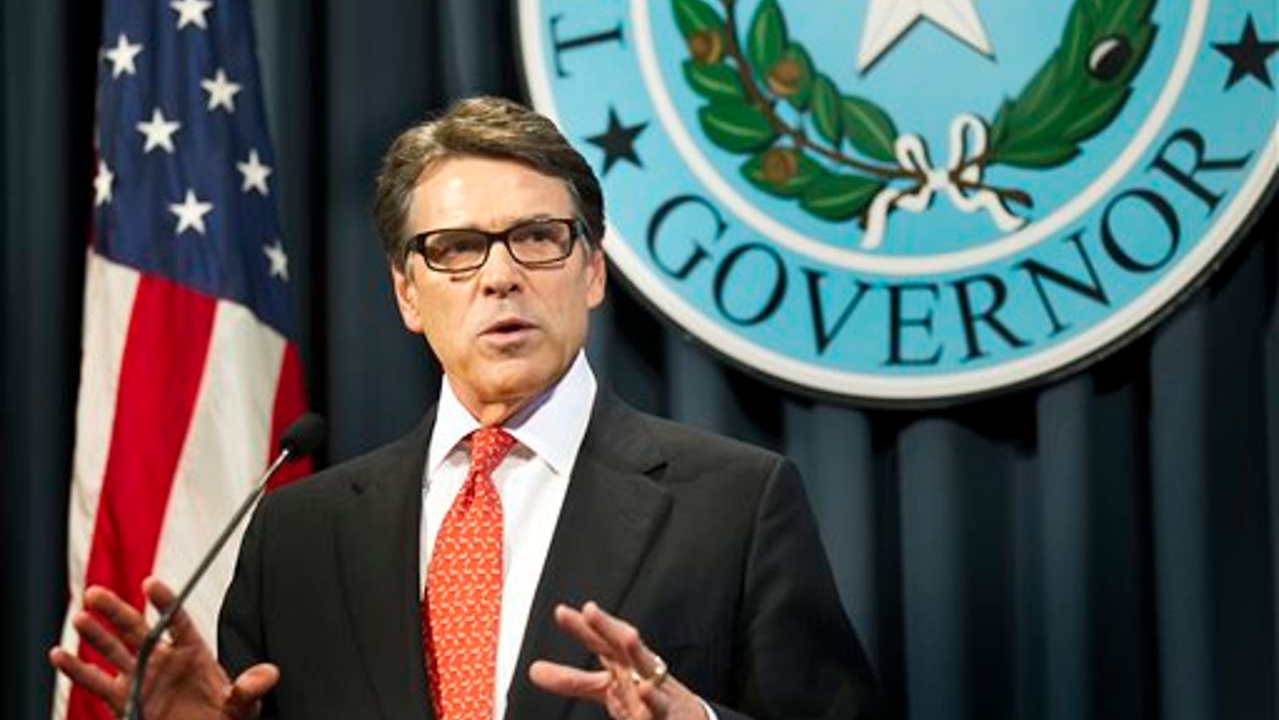 Gov. Rick Perry makes a statement in Austin, Texas on Saturday, Aug. 16, 2014 concerning the indictment on charges of coercion of a public servant and abuse of his official capacity. Perry is the first Texas governor since 1917 to be indicted. (AP Photo/Austin American-Statesman - statesman.com, Laura Skelding)