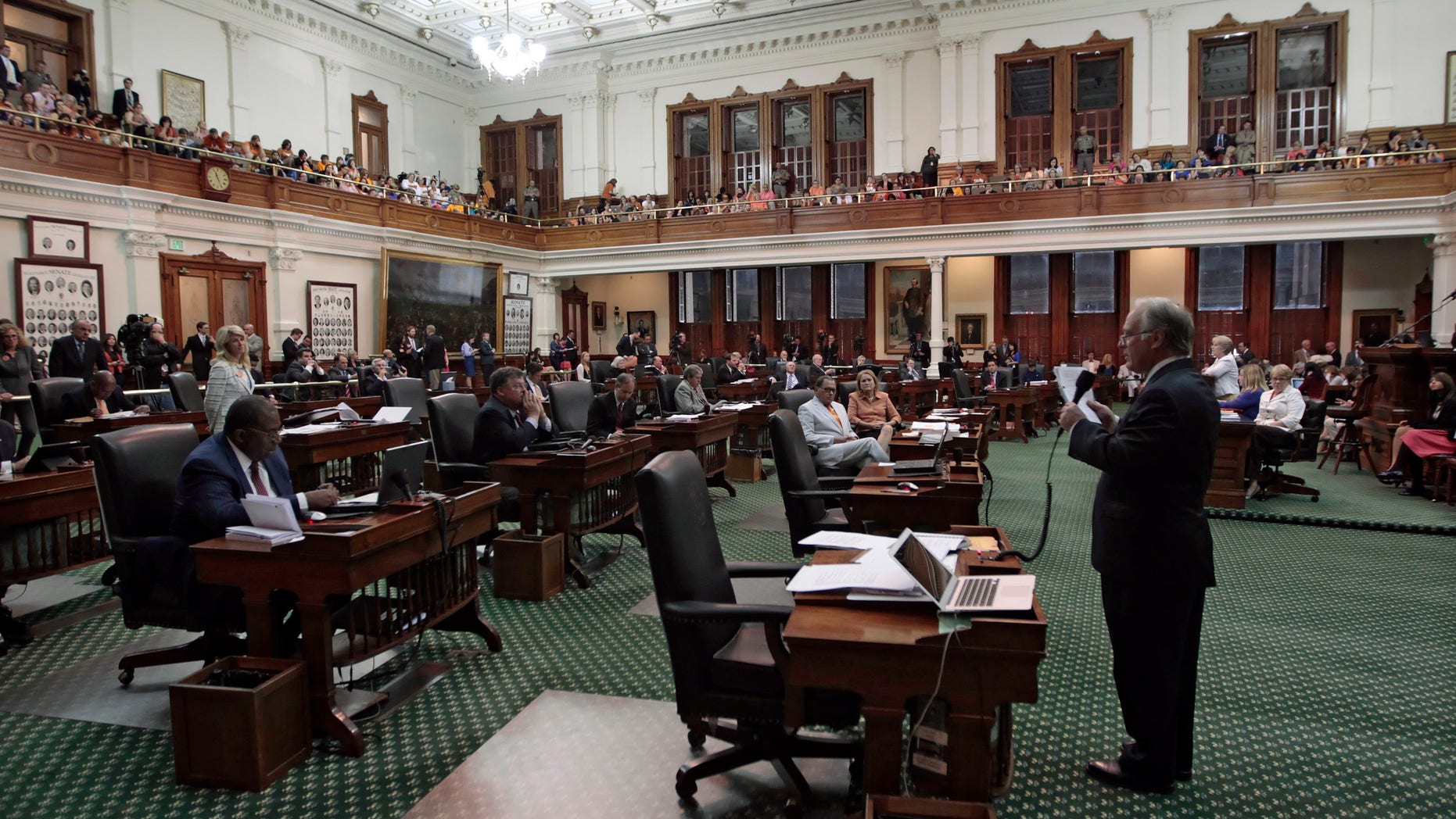 AUSTIN, TX - JUNE 25: State Sen. Kirk Watson (D-Austin) helps the Democrats defeat the anti-abortion bill SB5, which was up for a vote on the last day of the legislative special session June 25, 2013 in Austin, Texas. A combination of a 13-hour filibuster by State Sen. Wendy Davis (D-Ft. Worth) and protests by reproductive rights advocates helped to ultimately defeat the controversial abortion legislation at midnight. (Photo by Erich Schlegel/Getty Images)