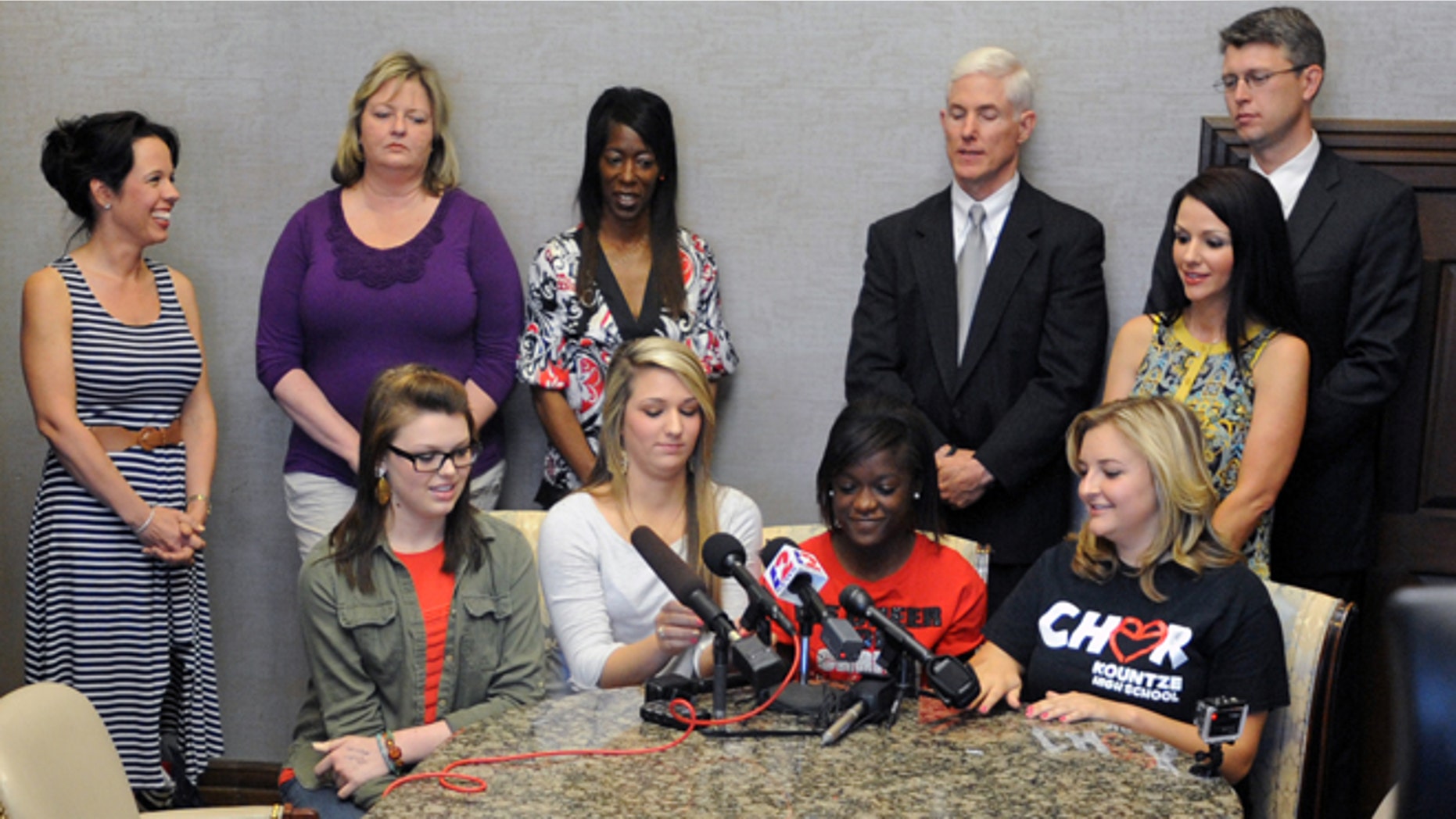 May 8, 2013: Kountze High School cheerleaders, from left, Savannah Short, Macy Matthews, Kieara Moffett and Rebekah Richardson speak to reporters in Beaumont, Texas.