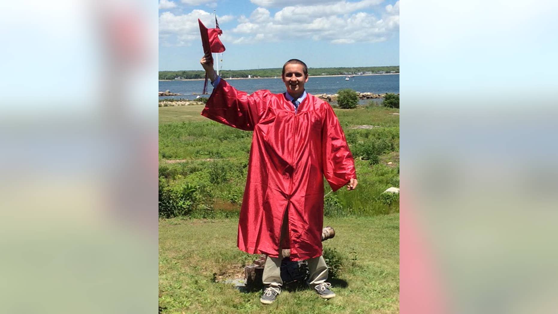 In this June 7, 2014 photo provided by his grandmother Janice Roy, Conrad Roy III celebrates his high school graduation Old Rochester Regional High School in Mattapoisett, Mass. He killed himself the following month. Prosecutors charged his girlfriend, Michelle Carter of Plainville, Mass., with involuntary manslaughter for allegedly pressuring him to take his own life. (Janice Roy via AP)