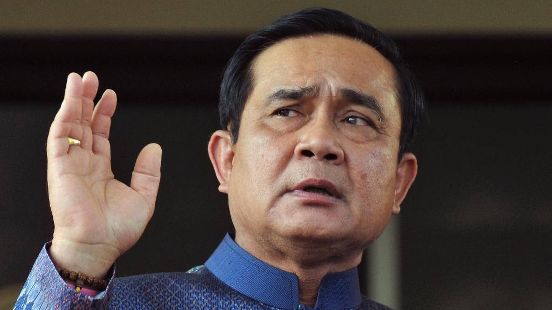 FILE - In this Tuesday, Aug. 18, 2015, file photo, Thailand's Prime Minister Prayuth Chan-ocha speaks to reporters in Bangkok. Prayuth, the former army chief who engineered the May 2014 coup, has said he had to take over the government to end protests and political clashes. (AP Photo) THAILAND OUT