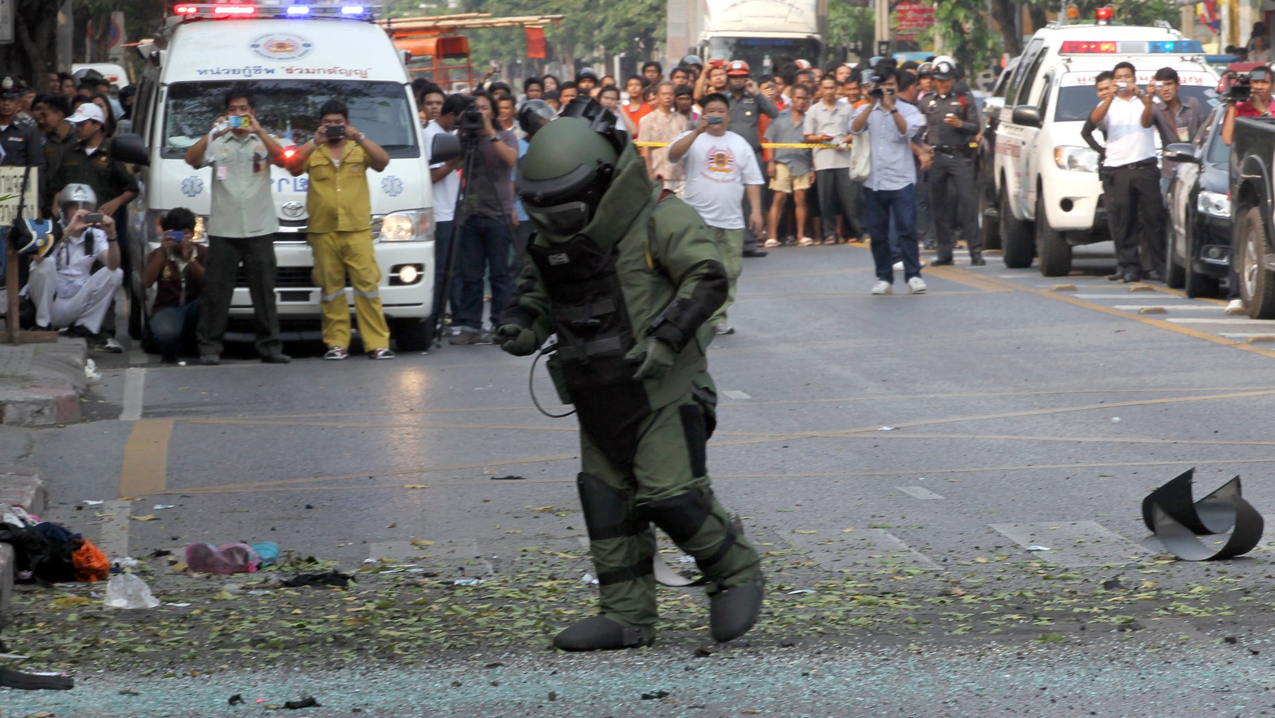 Feb. 14, 2012: A Thai Explosive Ordnance Disposal (EOD) official examines the bomb site in Bangkok, Thailand.