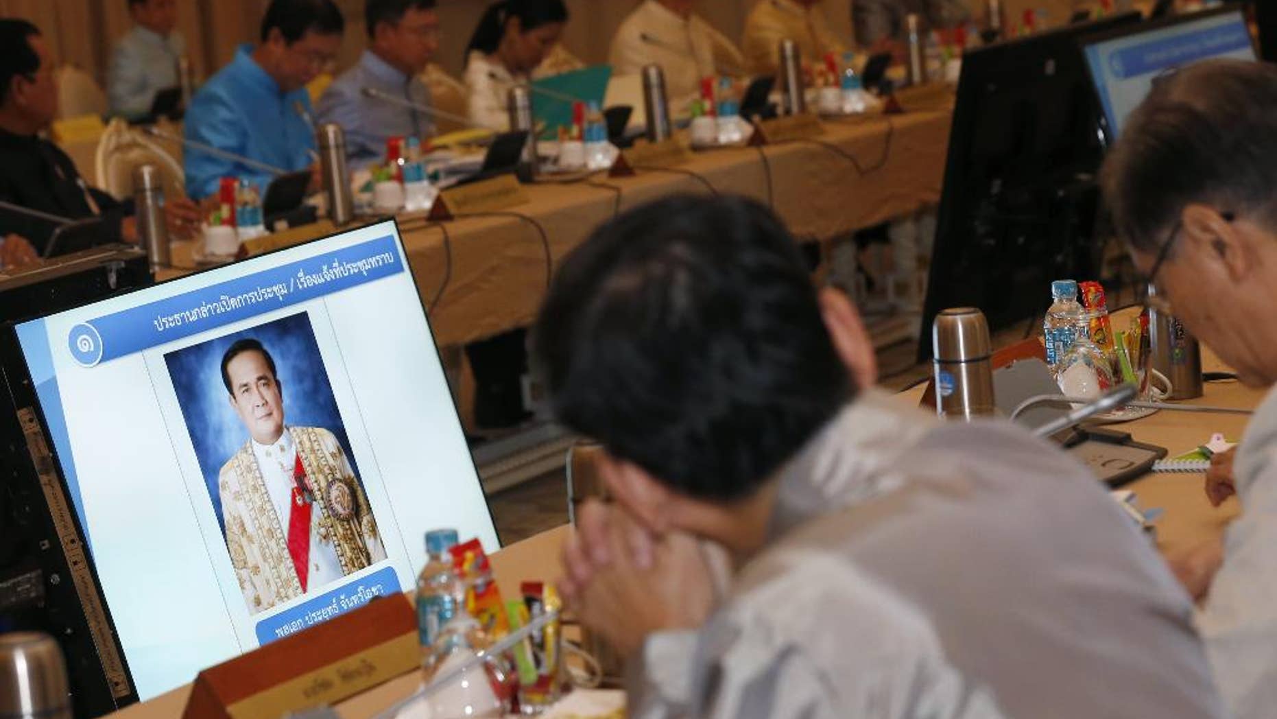 FILE - In this Sept. 9, 2014 photo, a portrait of Thai military junta chief and newly-appointed Prime Minister Gen. Prayuth Chan-ocha is shown on the television screen during the first cabinet meeting at Government House in Bangkok, Thailand. An international human rights group on Thursday, Sept. 11, 2014 called on Thailand's ruling military to end what it says is a "disturbing pattern of repression" in the country since the army seized power in a May coup. (AP Photo/Narong Sangnak, Pool, File)