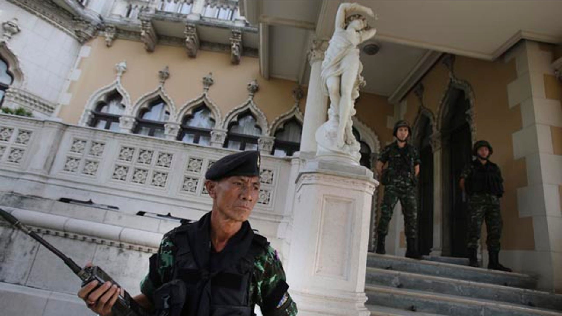 May 20, 2014: Thai soldiers stand guard outside Government House in Bangkok. (AP Photo/Sakchai Lalit)