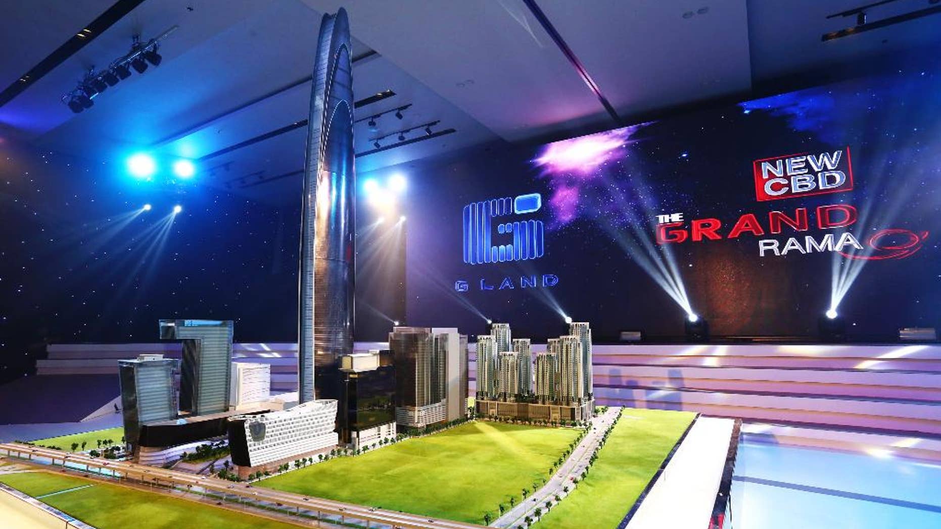 This Oct. 13, 2014 photo released by Grand Canal Land Public Company Ltd. shows a scale model of a skyscraper that a property developer plans to build in Bangkok that will be among the 10 tallest buildings in the world when it is completed in 2019. The 125-floor tower will rise 615 meters (2,018 feet) and include a luxury hotel, offices and an observation deck with panoramic views of the Thai capital, the developer said in a statement. (AP Photo/Grand Canal Land Public Company Ltd.)