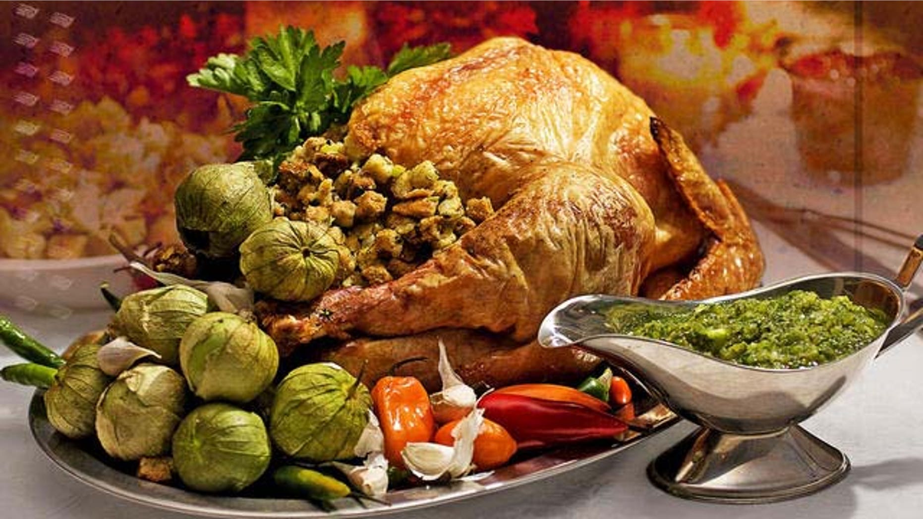 **FOR USE WITH AP LIFESTYLES** **FILE** This Oct. 19, 2008 file photo shows a Grill-roasted Brined Turkey with Anaheim Chile Salsa Verde. To save money this Thanksgiving brine your own bird. (AP Photo/Larry Crowe, FILE)