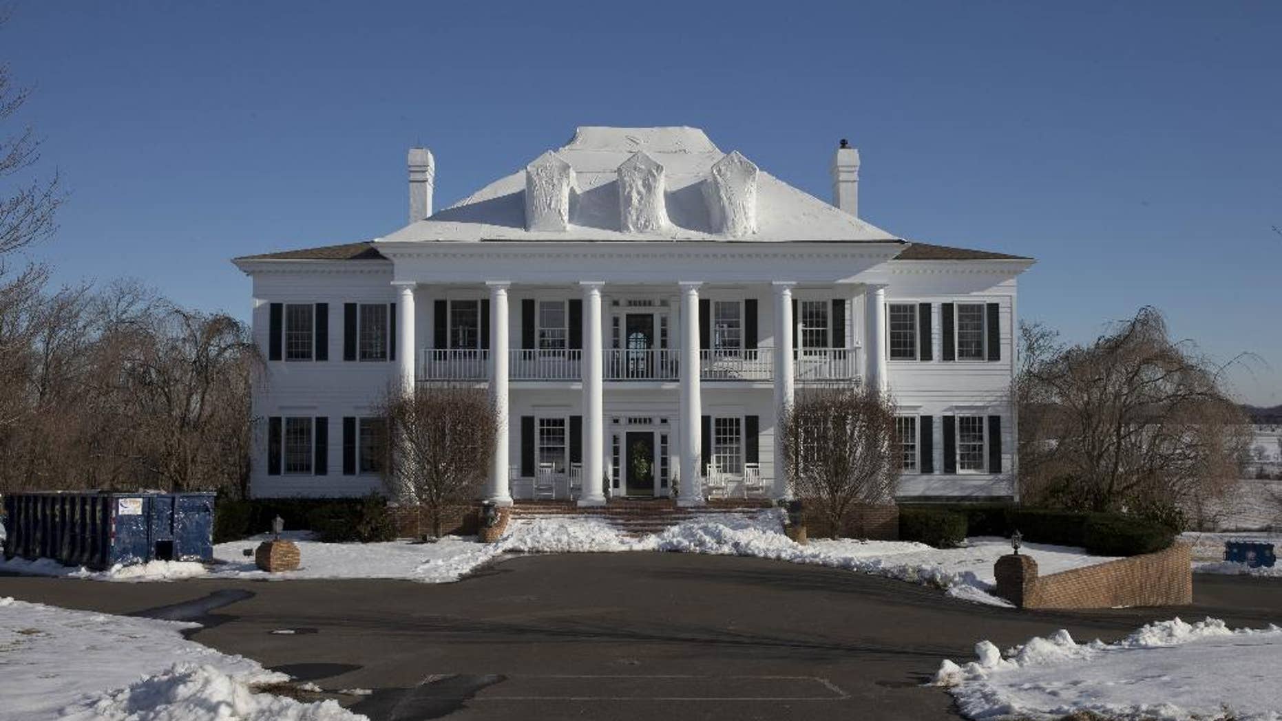 FILE - In this Wednesday, Feb. 11, 2015 photo shows the mansion called “Clairemont,” in New Hope, Pa. The family whose mansion burned three times in five years heads to court for a hearing to determine if they'll face trial in a $20 million insurance fraud case. The state attorney general's office has accused political fundraiser and hostess Claire Risoldi and her family of living large on trumped-up insurance claims. A grand jury report says the home in suburban Philadelphia has had three suspicious fires in five years. (AP Photo/Matt Rourke)