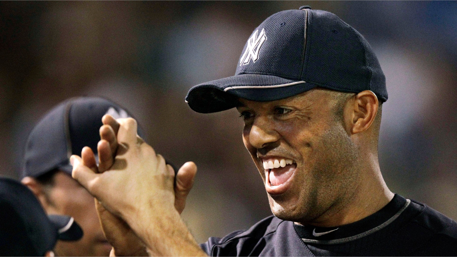New York Yankees reliever Mariano Rivera, 42, is congratulated as he returns to the dugout after pitching a scoreless fourth inning during a spring training baseball game against the Pittsburgh Pirates at Steinbrenner Field in Tampa, Fla. The number of players in their 40s is shrinking, with 13 quadragenarians in the majors last year, down from an all-time high 26 in 2007. (AP Photo/Kathy Willens, File)