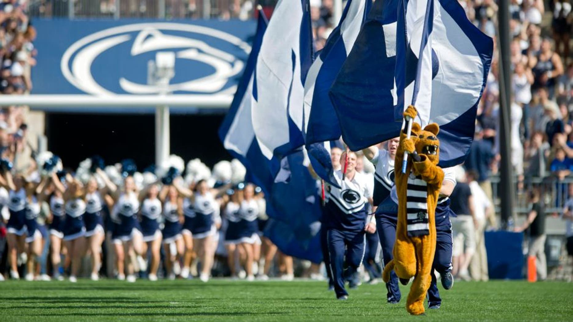 The Penn State Nittany Lion leads the cheerleaders and the football team onto the field for the Blue White game on Saturday, April 18, 2015, at Beaver Stadium in University Park, Pa. (Abby Drey/Centre Daily Times/TNS via Getty Images)