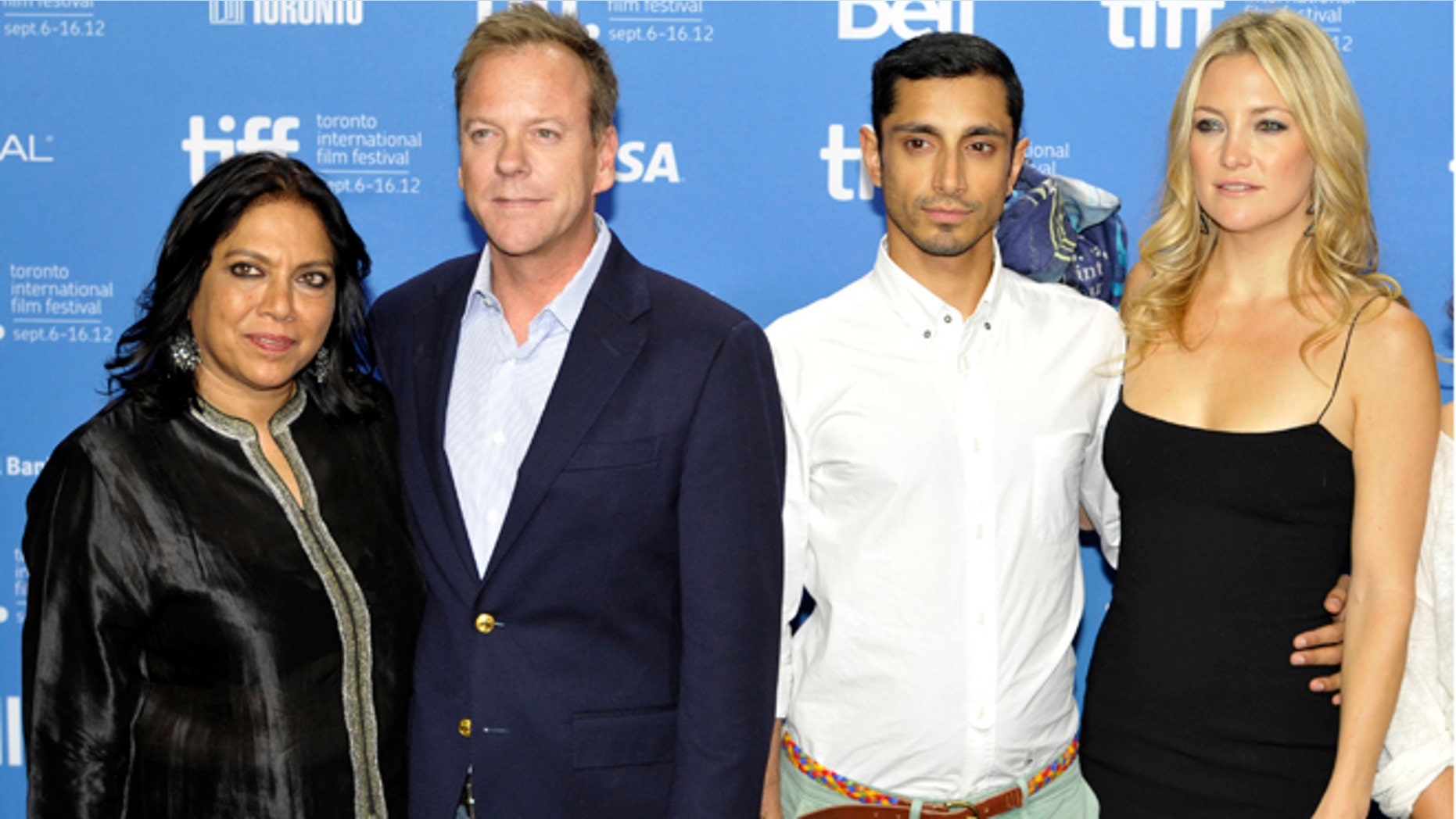 Director Mira Nair, left, poses with cast members (from left) Kiefer Sutherland, Riz Ahmed and Kate Hudson at a news conference for their film "The Reluctant Fundamentalist" at the 37th Toronto International Film Festival September 9, 2012.