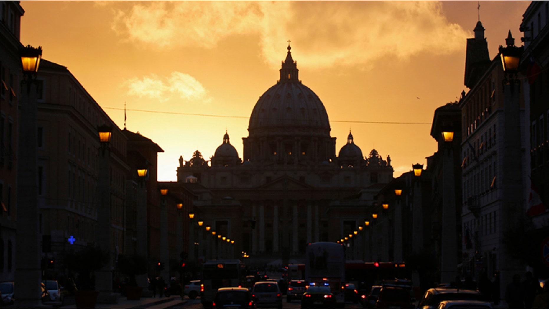 Saint Peter's Basilica at the Vatican is silhouetted during sunset in Rome. Roman Catholic Cardinals will begin their conclave inside the Vatican's Sistine Chapel Tuesday to elect a new pope.