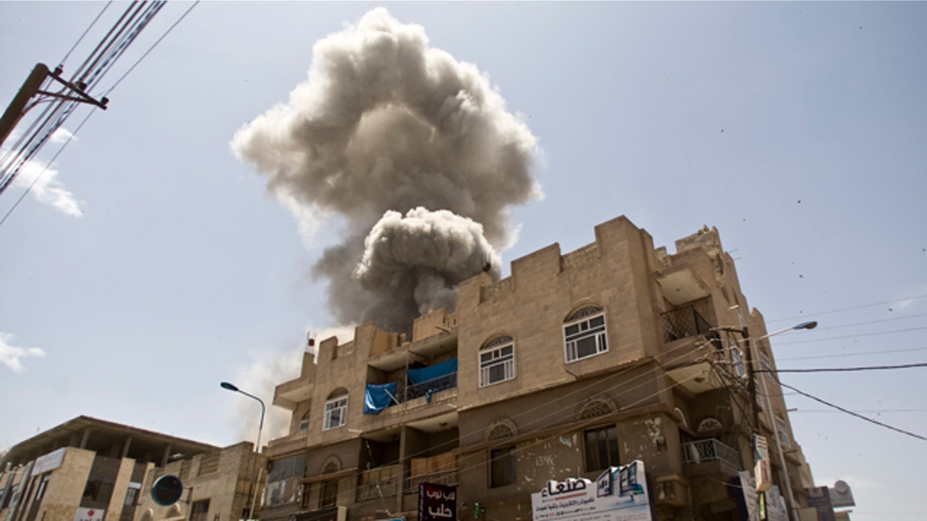 May 10, 2015: Smoke rises from a house of former Yemeni president Ali Abdullah Saleh after a Saudi-led airstrike in Sanaa, Yemen. (AP Photo/Hani Mohammed, File)