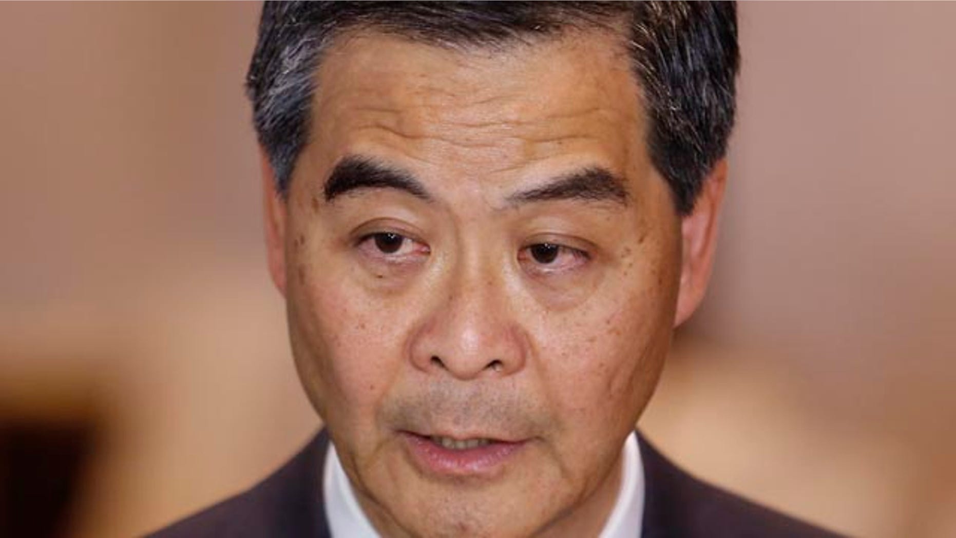 October 15, 2014: Hong Kong Chief Executive Leung Chun-ying speaks to the media after a presentation ceremony in Hong Kong. (AP Photo/Kin Cheung)