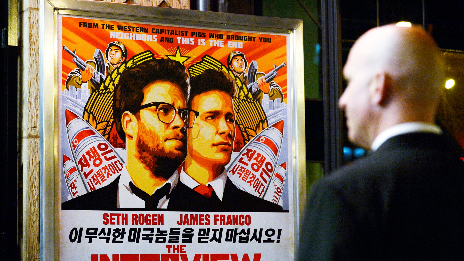 A security guard stands at the entrance of United Artists theater during the premiere of the film "The Interview" in Los Angeles, Dec.11.