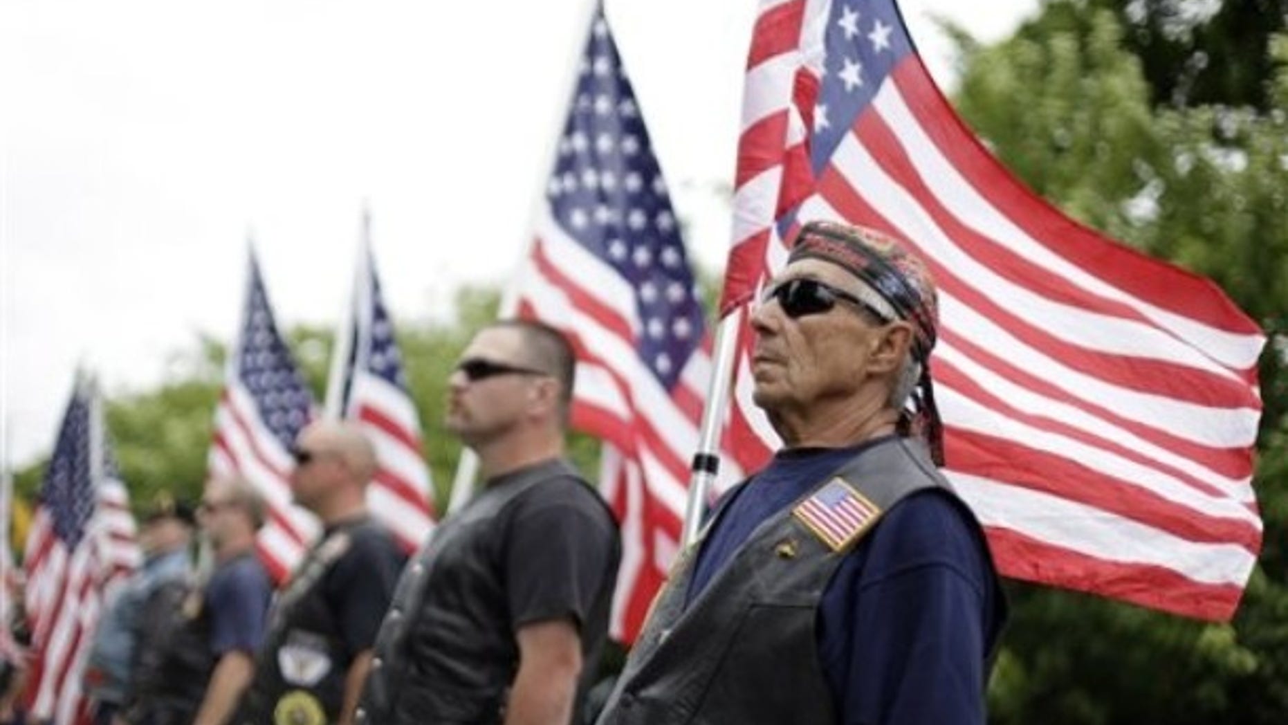 Members of the Patriot Guard Riders stand at attention during the funeral service for 1st Lt. Joseph J. Theinert at the Shelter Island School, Friday, June 11, 2010 in Shelter Island, N.Y. Theinert, 24, was killed by a makeshift bomb June 4, 2010 in Afghanistan.